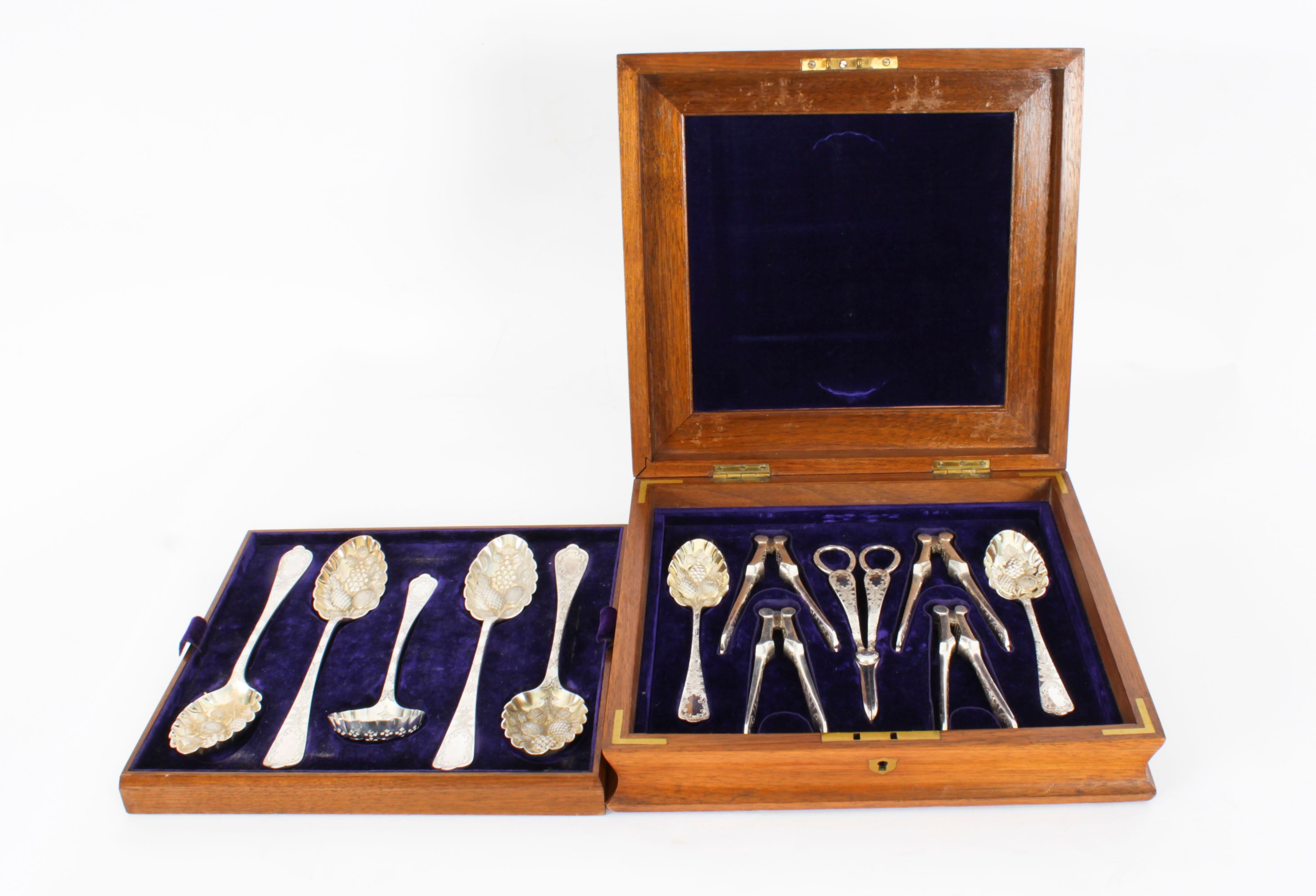 This is a beautiful antique Victorian burr walnut boxed twelve piece silver plated dessert service with maker marks for Hukin & Heath, circa 1880 in date.         
   
Comprising six berry spoons, a sifting spoon, two pairs of nut crackers  and