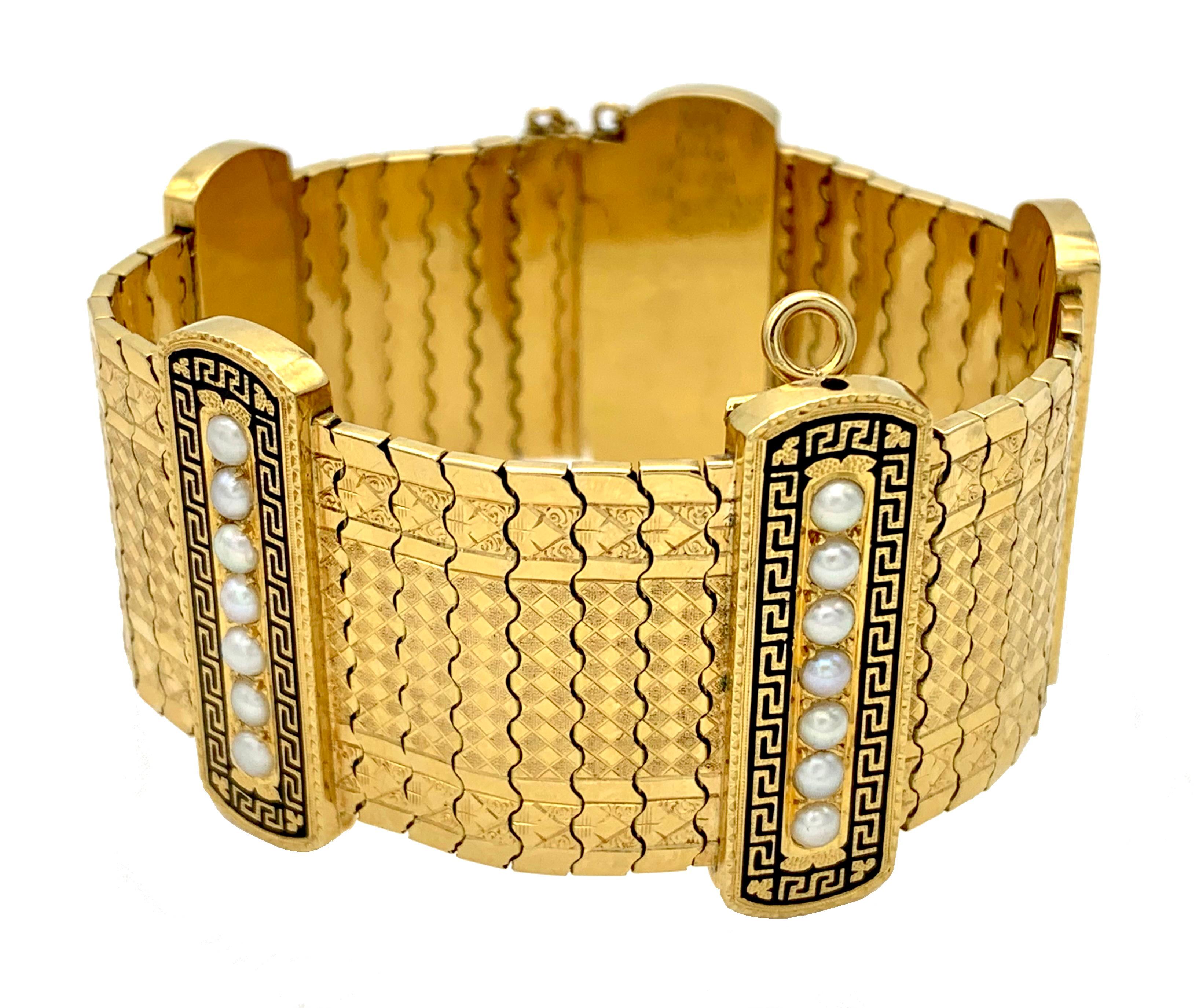 This very fine quality articulated bracelet was made in 1875 ca out of 18 karat gold. Five gold segments are set with 7 natural oriental pearls each within a finely chiselled Greek key pattern surrounded by black enamel. The pearl set segments
