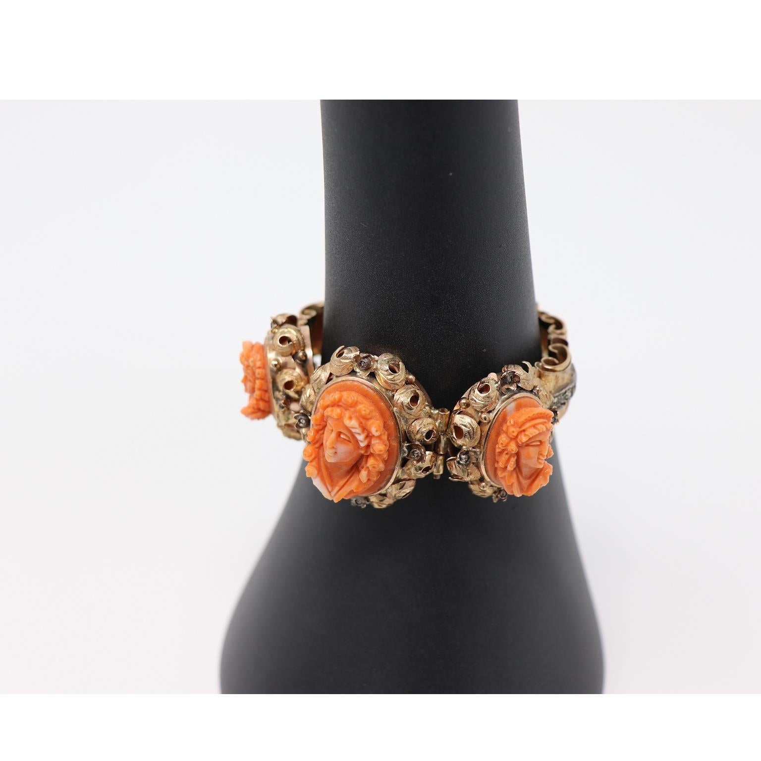 Rare beautiful antique bracelet in rose gold 375 with silver diamonds set with small diamonds. Gold is finely engraved by hand. The three large red coral cameos carved by hand in relief figures are of great value. High quality Italian goldsmith
