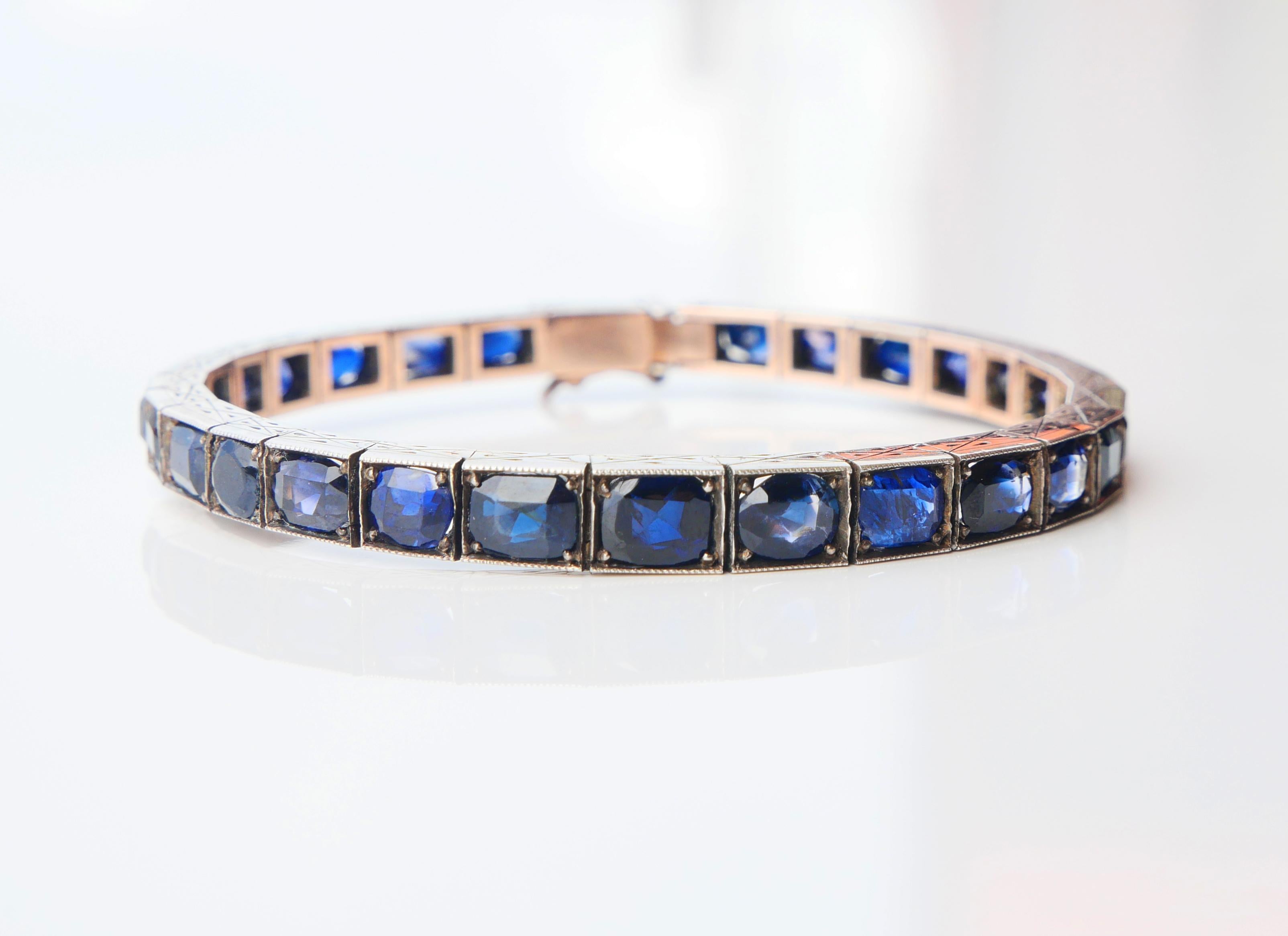 Antique Bracelet from ca. 1920s - 1930s in solid Silver with layer of 10 - 12K Gold on the back side with with 28 hand - engraved sections holding 29 natural Sapphire stones of various sizes with total weight of ca. 20ct. There are both oval and old