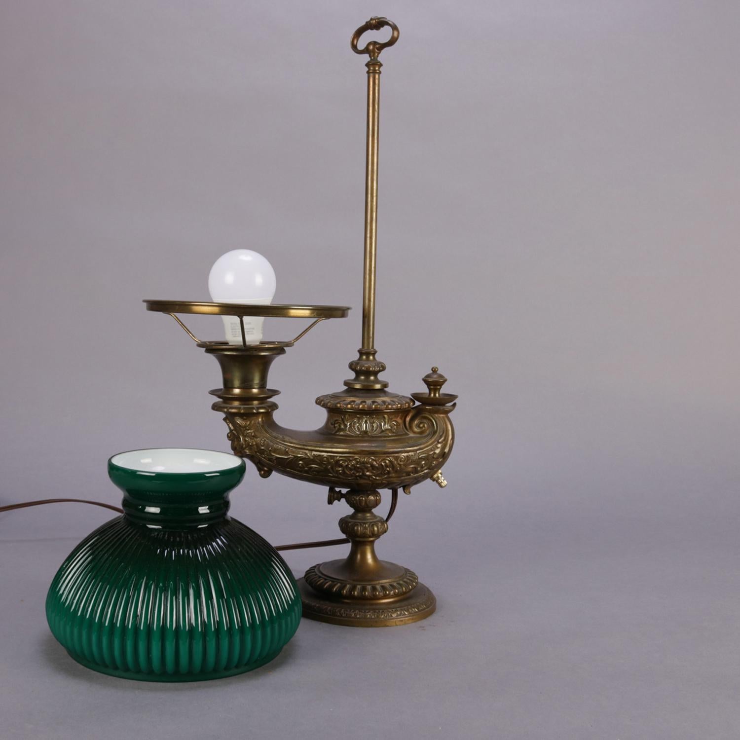An antique Bradley & Hubbard School student oil lamp features Aladdin lamp form font on adjustable post and having cased glass shade, professionally rewired, circa 1890.

Measures: 21
