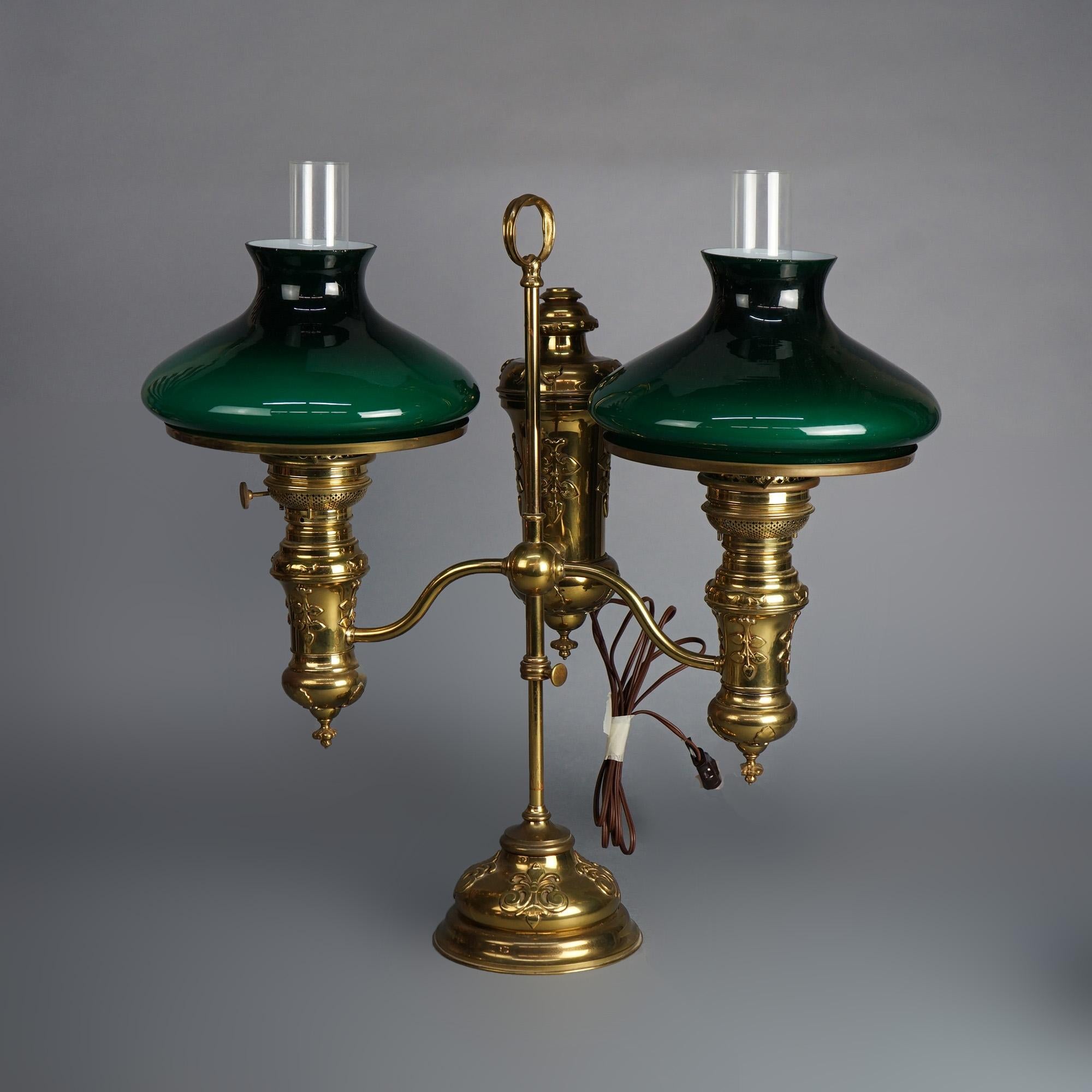 Antique Bradley & Hubbard Brass with Encased Deep Green Glass Double Student Lamp with Embossed Foliate Elements, Electrified, c1890

Measures - 26.5