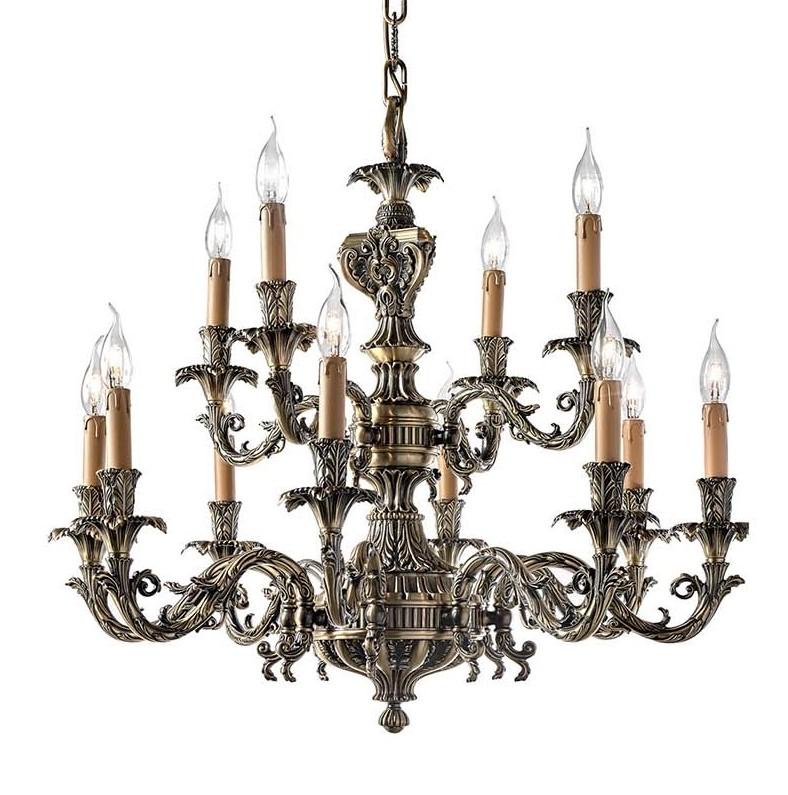 Masterfully crafted of solid brass with an ornate frond decoration over the entire structure, this superb chandelier showcases two tiers of scrolled arms (12+6) with a two-tone, antique finish that enhances the details of the skilled hand-wrought
