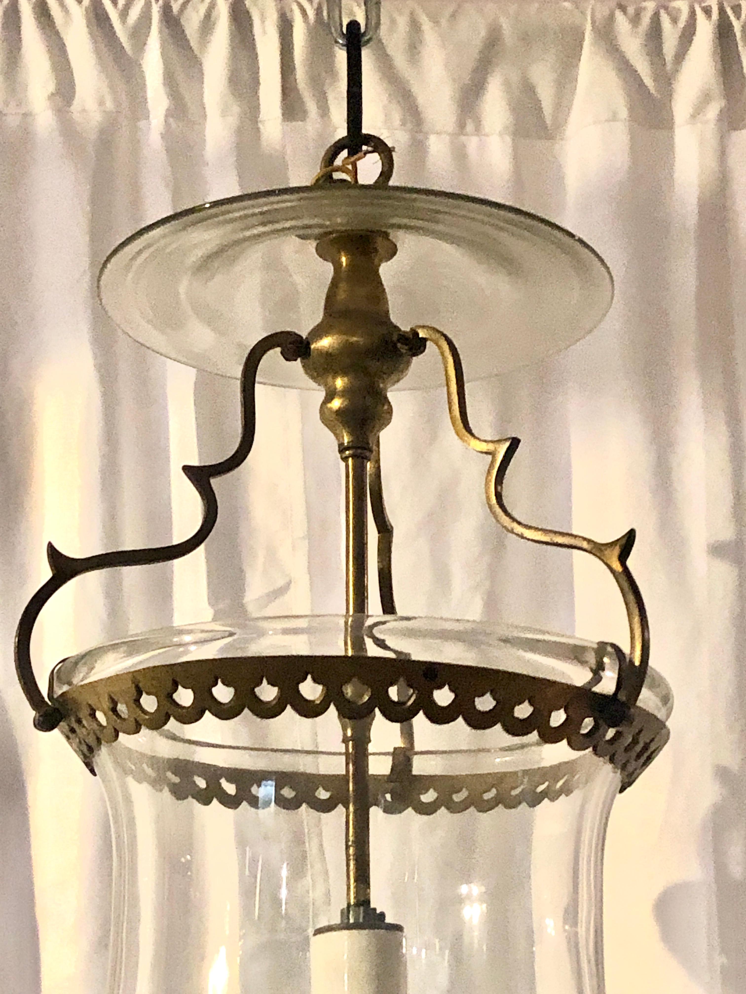 Antique brass and blown glass hall lantern, Circa 1920.
A very handsome fixture with nice lines and of smaller dimension. It would look perfect in a hallway or foyer entrance.