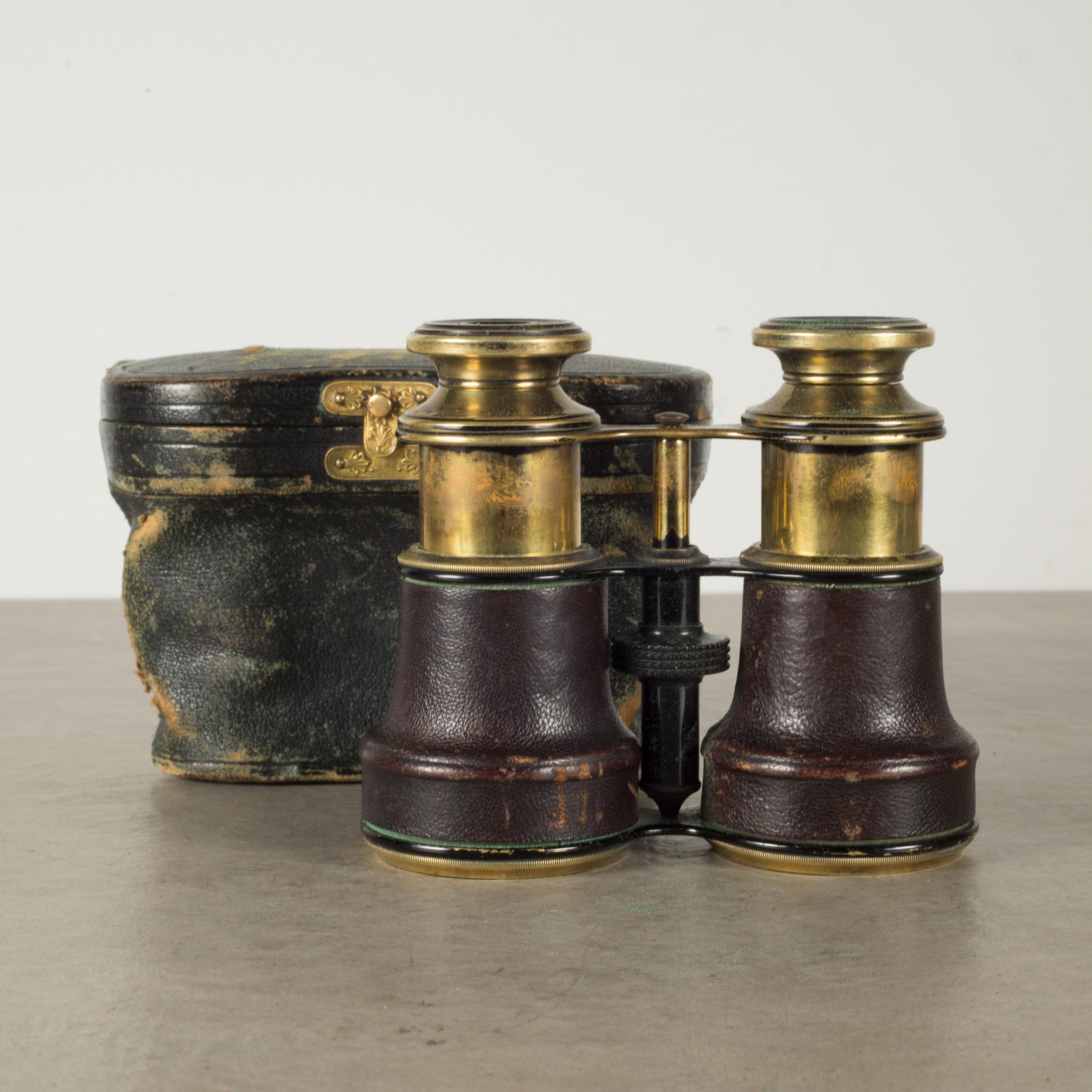 ABOUT

A pair of solid brass binoculars wrapped in leather with original case. The objective lenses are 42 mm in diameter and their optics are good. The barrels are covered with brown leather. The focus wheel works well with good binocular