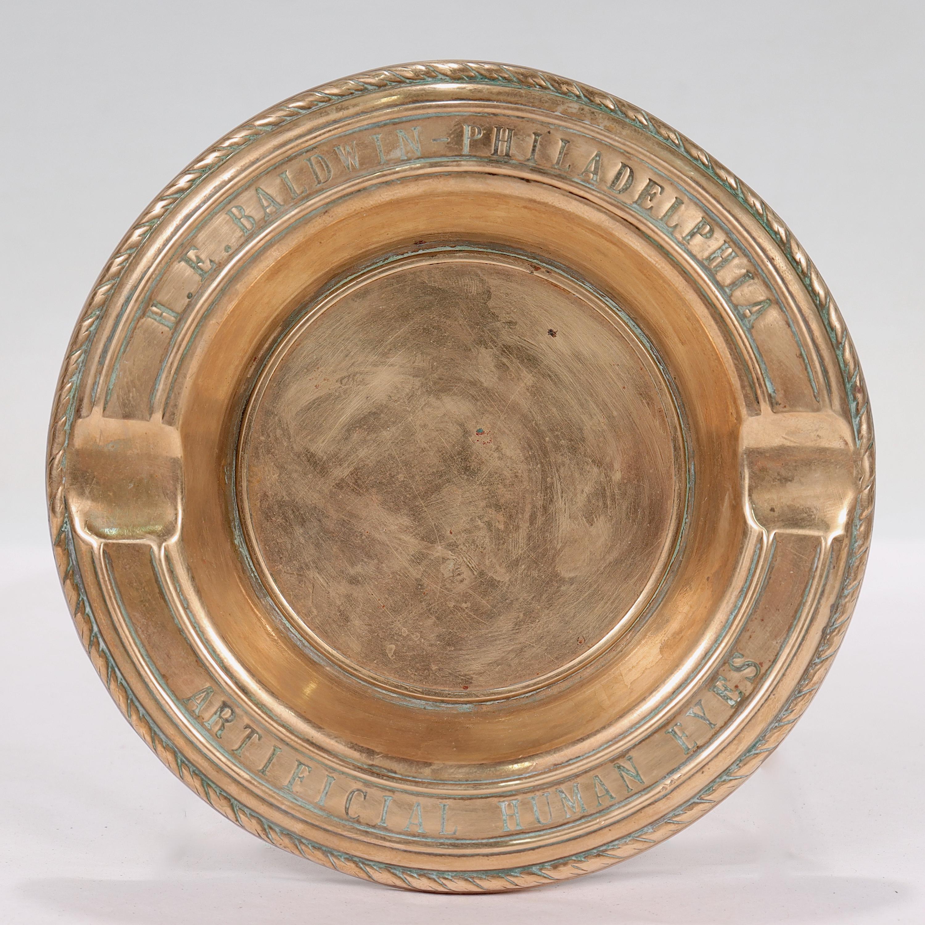 An odd obscura collectible in the form of a rare, antique brass advertising ashtray.

The ashtray is engraved with 