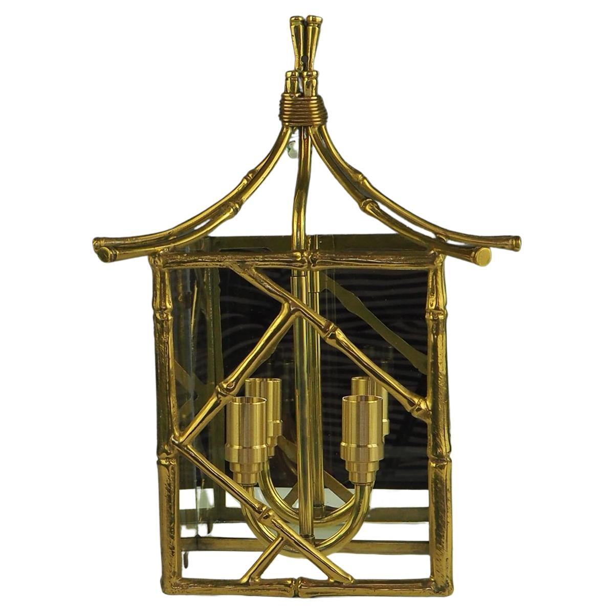 Art Deco Brass Bamboo Wall Lantern by Maison Bagues

1930s French 

Very elegant design, with mirrored back and glass sides and front

Replacement lampholders with new wiring, ready for wall mounting to home wiring circuit