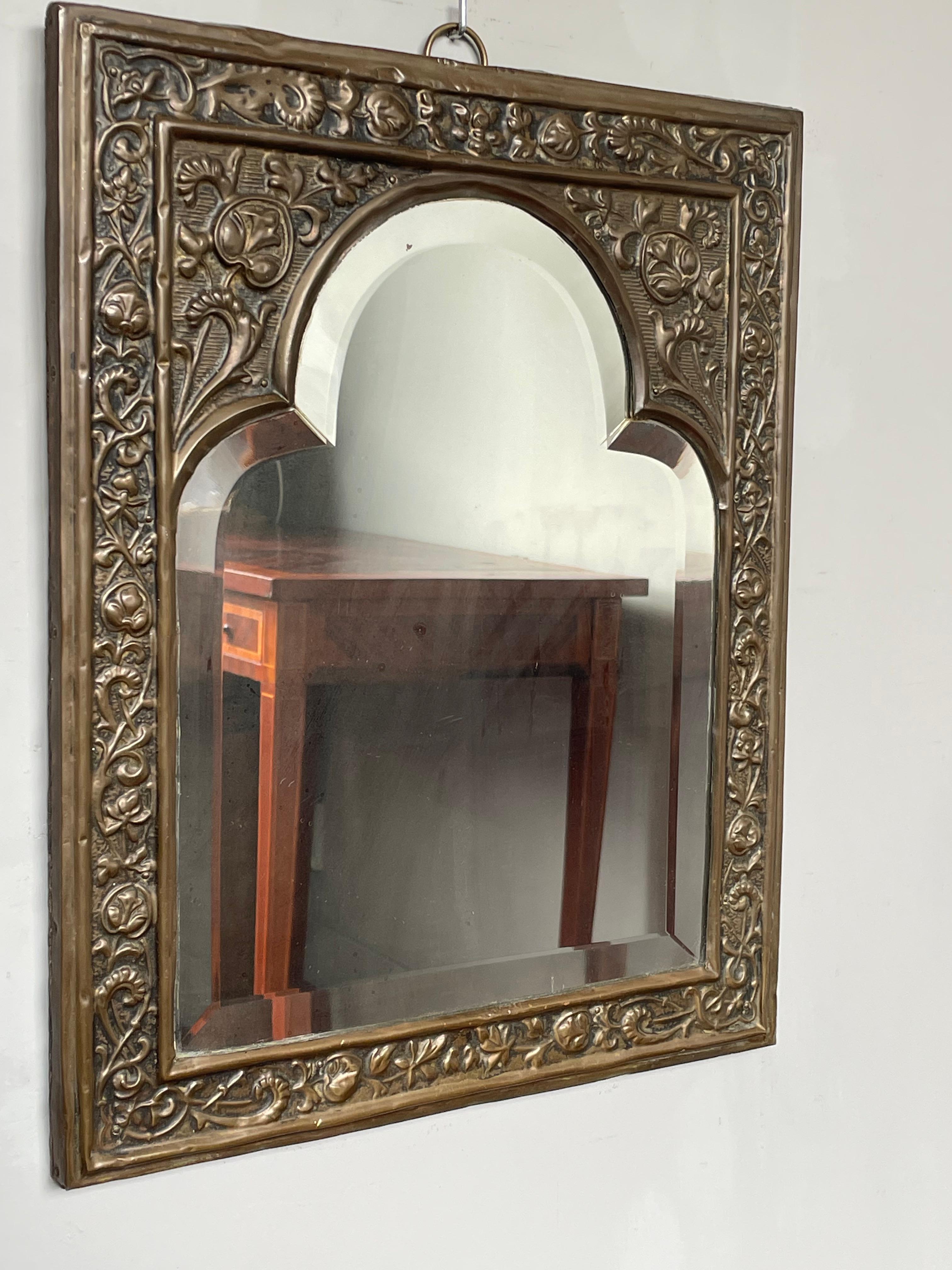 For the collectors of rare and practical Gothic Revival antiques.

This beautiful, turn of the century and all handcrafted Gothic art mirror is an absolute joy to own and to look at. The perfectly symmetrical, Gothic church window design with the