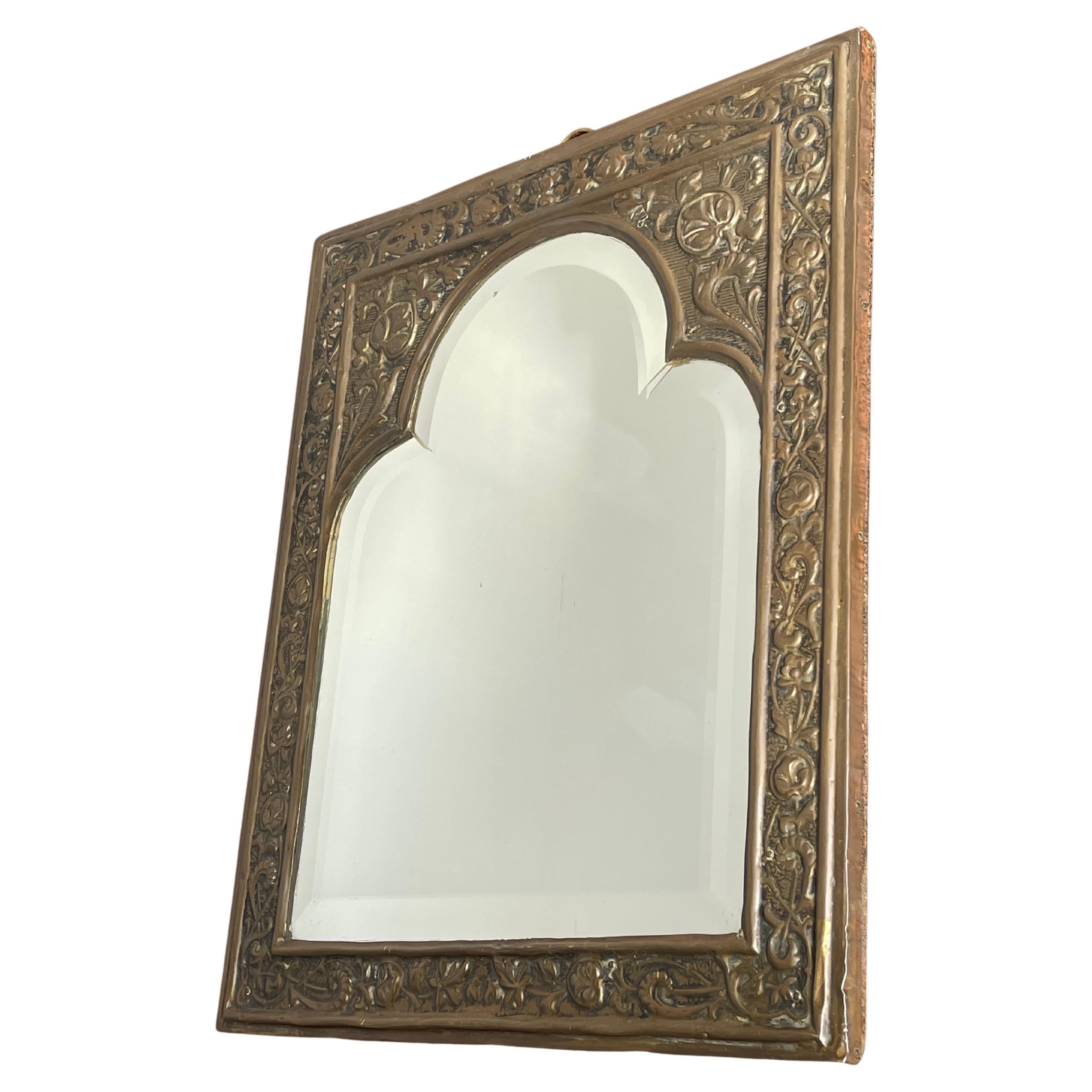 Antique Brass & Beveled Glass Gothic Revival Wall Mirror w. Embossed Decorations For Sale