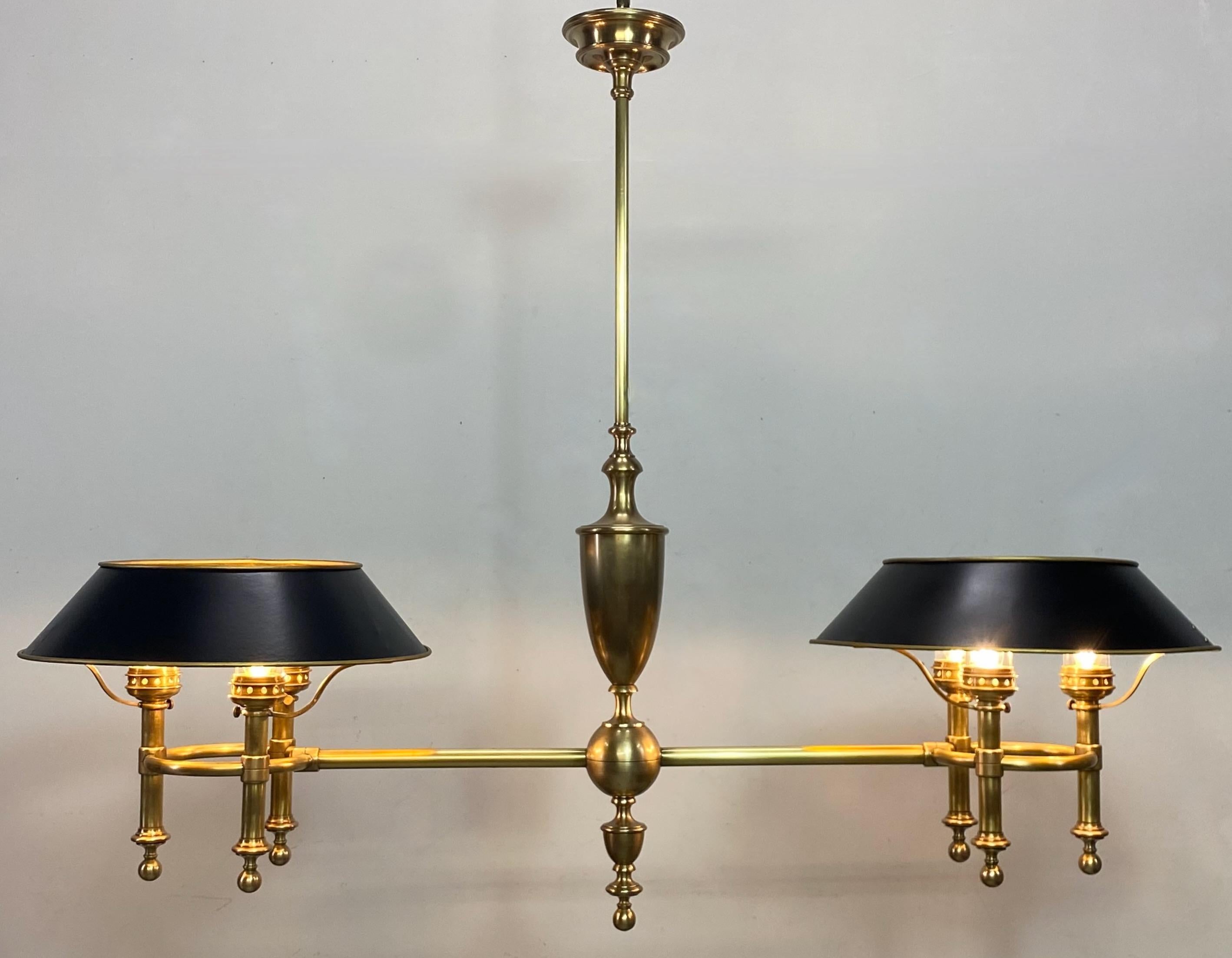 An extremely unusual antique solid brass billiard (pool) table light fixture that would look perfect to hang over a kitchen island as well.
Originally was a gas light, now converted to electric.
This has been fully disassembled and cleaned,
