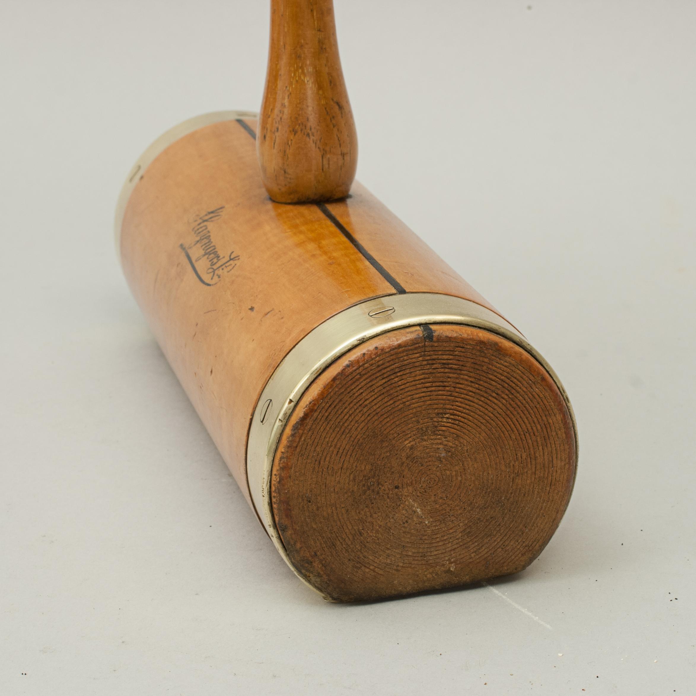 Antique Slazenger 'Corbally' Flat Bottom Croquet Mallet.
A fine usable flat bottom croquet mallet by Slazenger with brass plate to the bottom with brass reinforcing rings on the ends of the boxwood head, these add weight while helping protect the