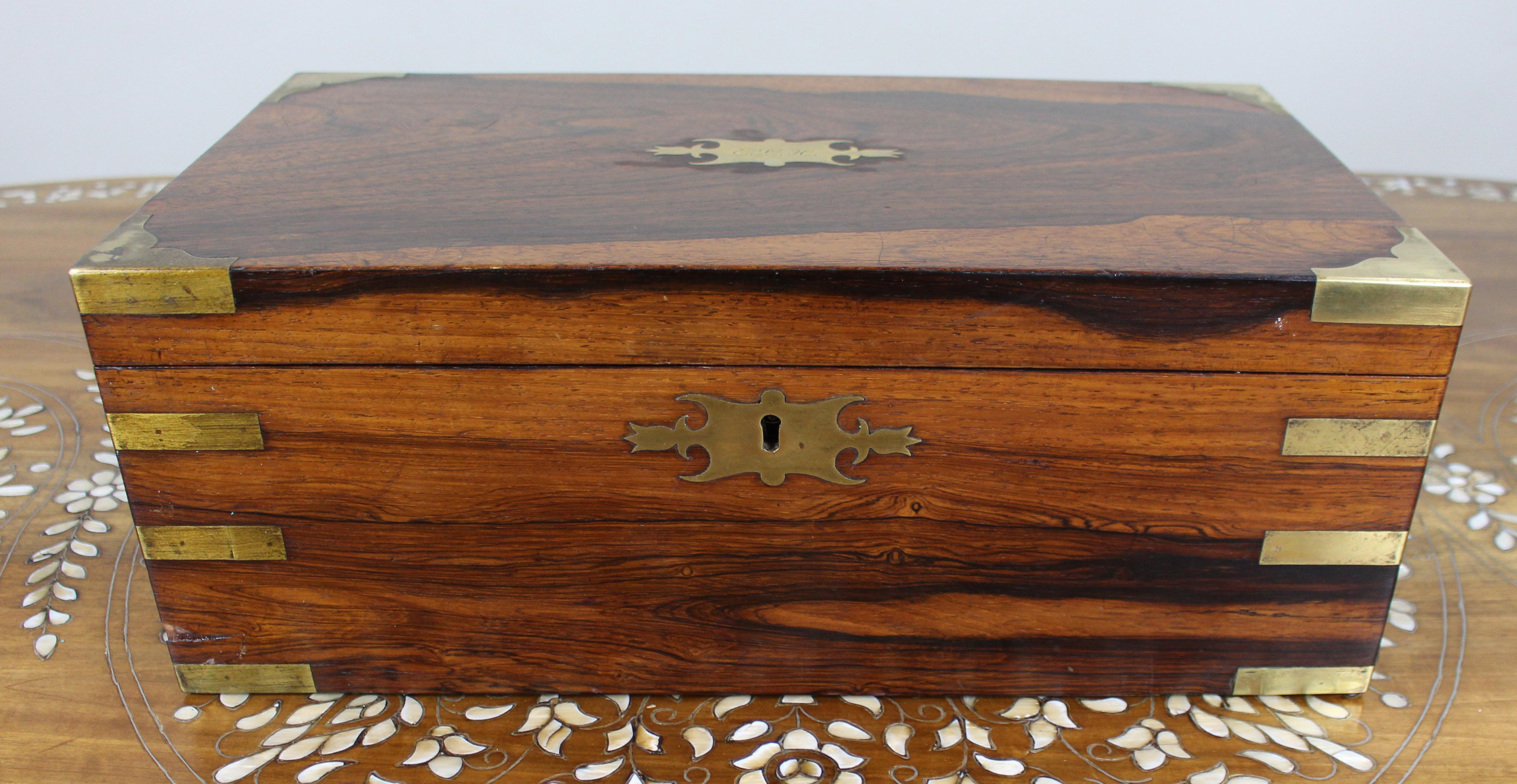 Antique Brass-Bound Rosewood Writing Slope, c.1850

Nice quality mid-19th century English brass-bound writing slope in richly figured rosewood, dating to around 1850.

The rectangular case is fitted with brass corner straps, side campaign-style