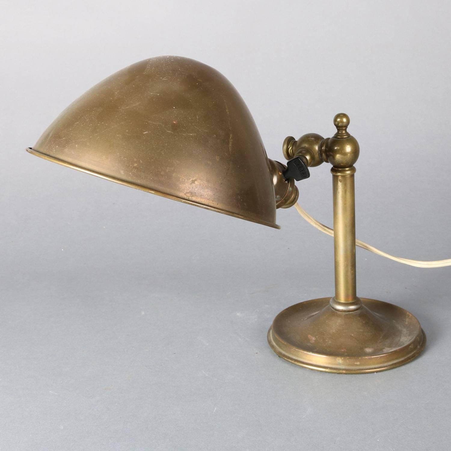 Antique brass gilt Bradley & Hubbard School desk lamp features industrial form with adjustable arm and dome shade, circa 1910

Measures: 11