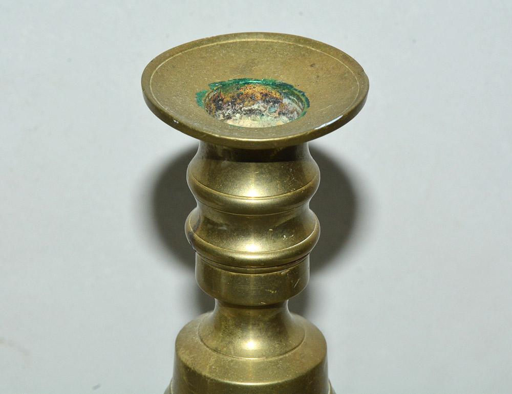 Georgian brass candlestick with cut corners square base and lovely turned stems of heavy construction, wonderful aged patina.