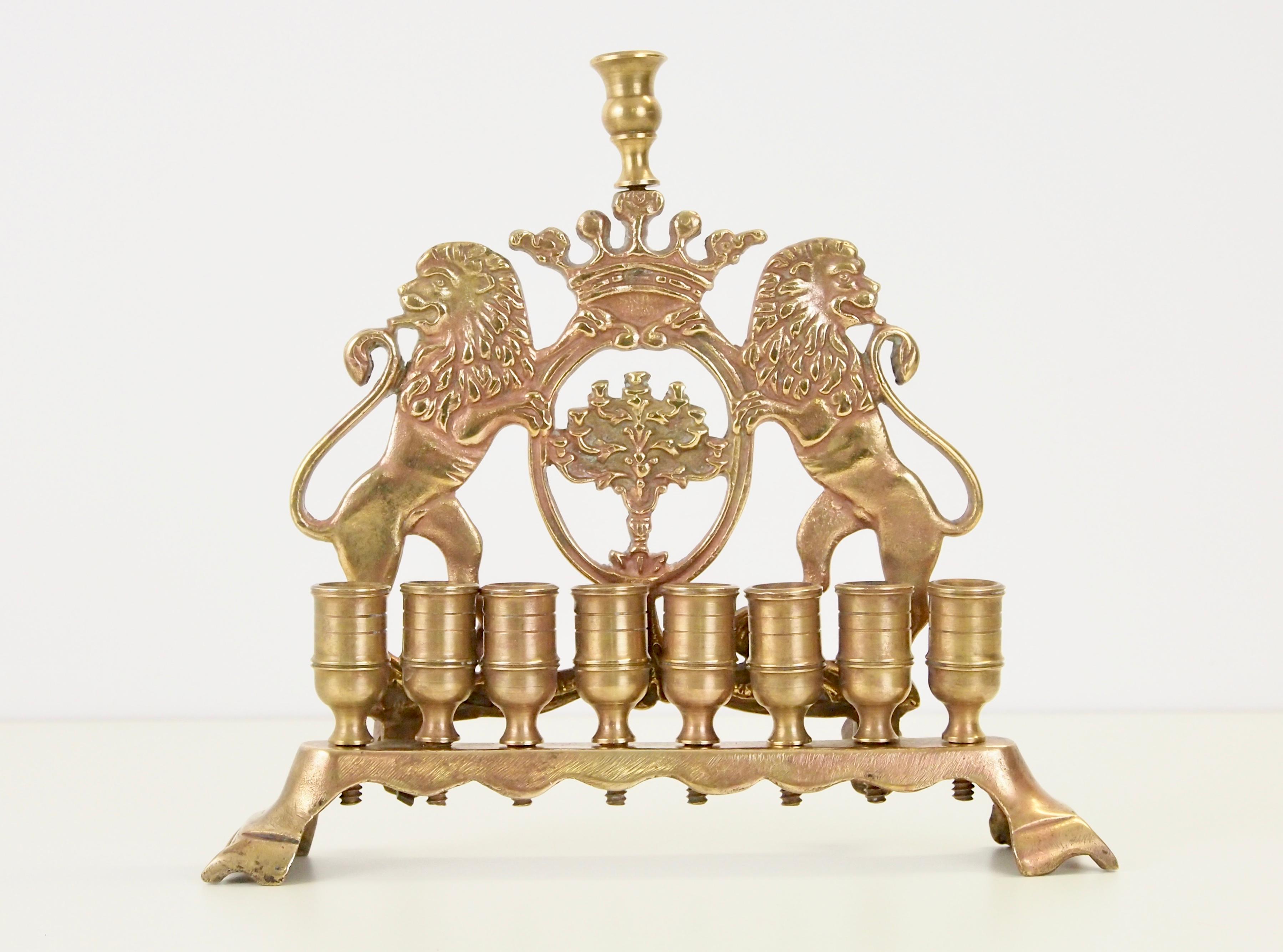 Magnificent and finely detailed rampant Judaica lions with full manes decorate this Chanukah Menorah. This Chanukah is based on 18th century Menorah from Lithuania.

Seen the signature at the back this Chanukah dates from 1820.
There is still