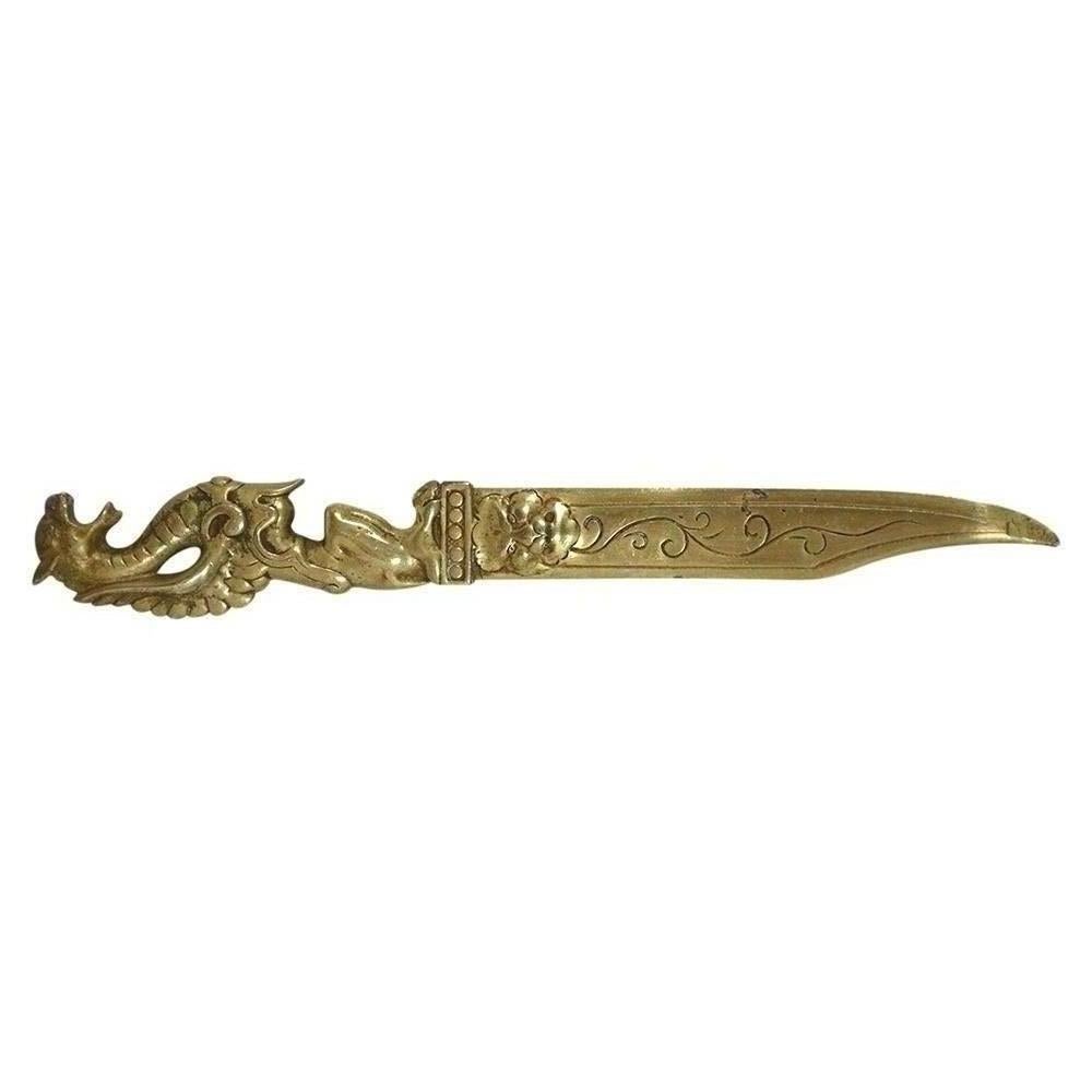 An antique Chinese letterheads opener that has been handcrafted out of brass with a polished finish. This letter opener has a very detailed dragon handle and an elegant etch design along the blade. This 19th century brass letter opener would make a