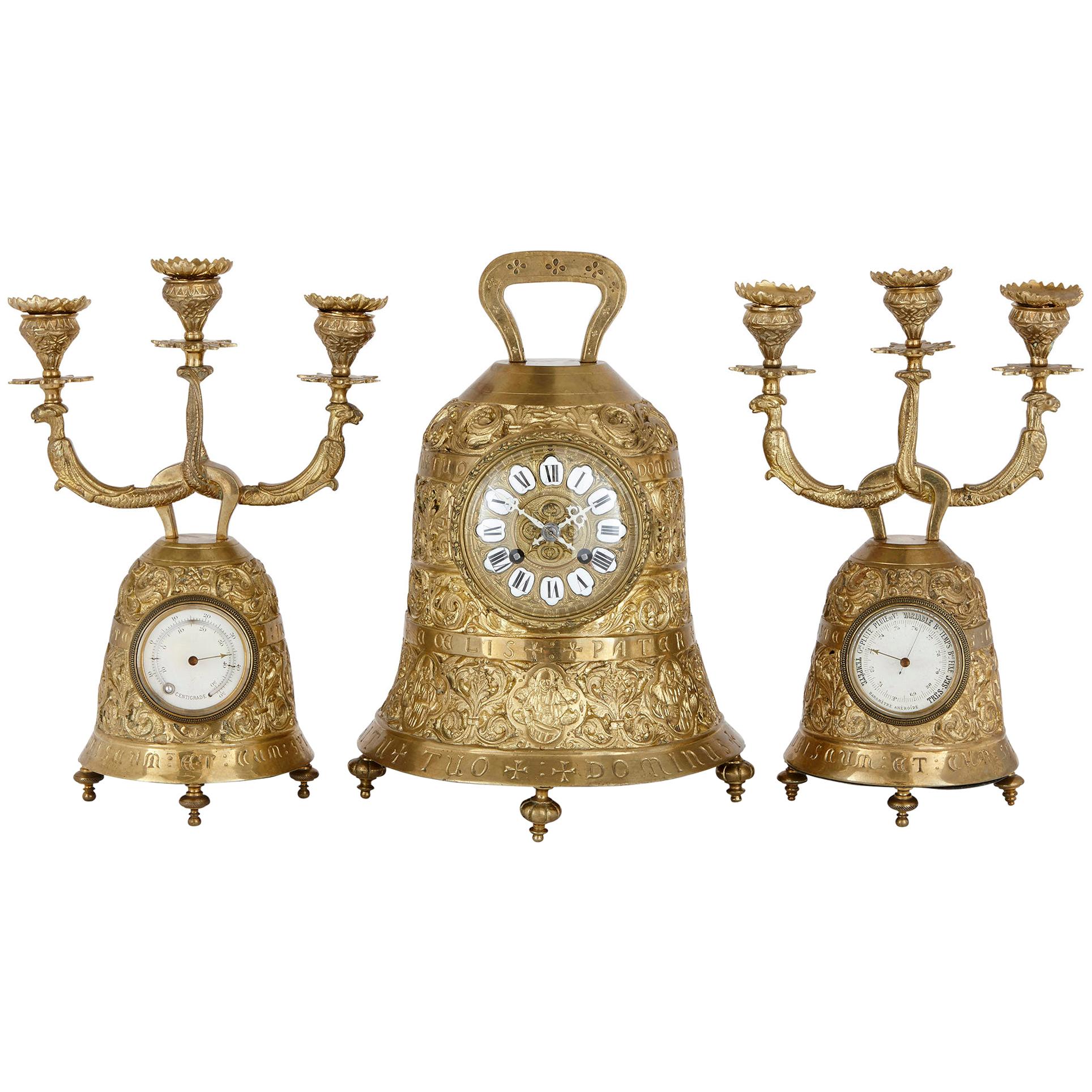 Antique brass clock set with religious decoration  For Sale