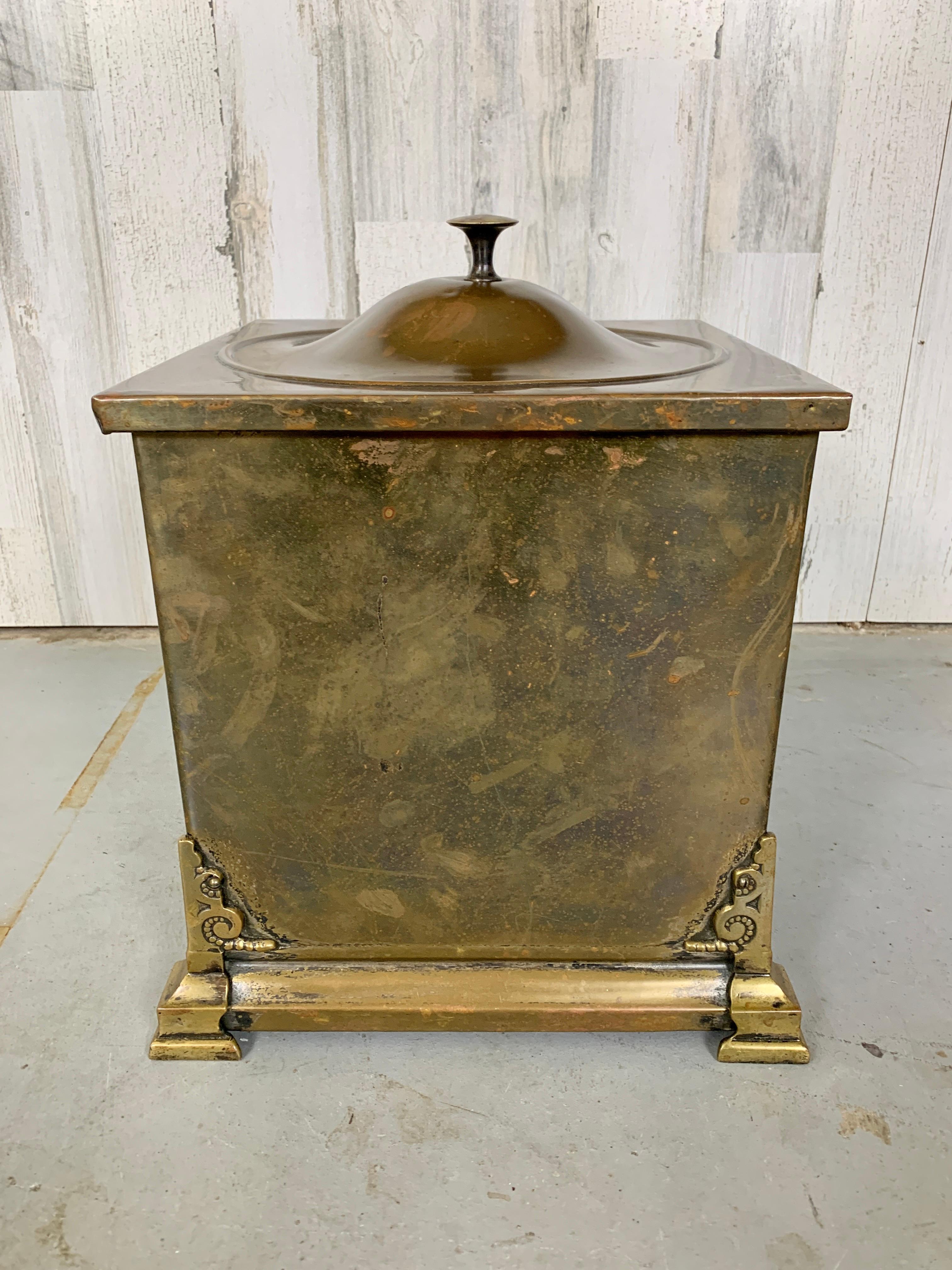 Decorative brass coal bucket with Zinc insert and Fleur De Lis handles
Nice patina through out.