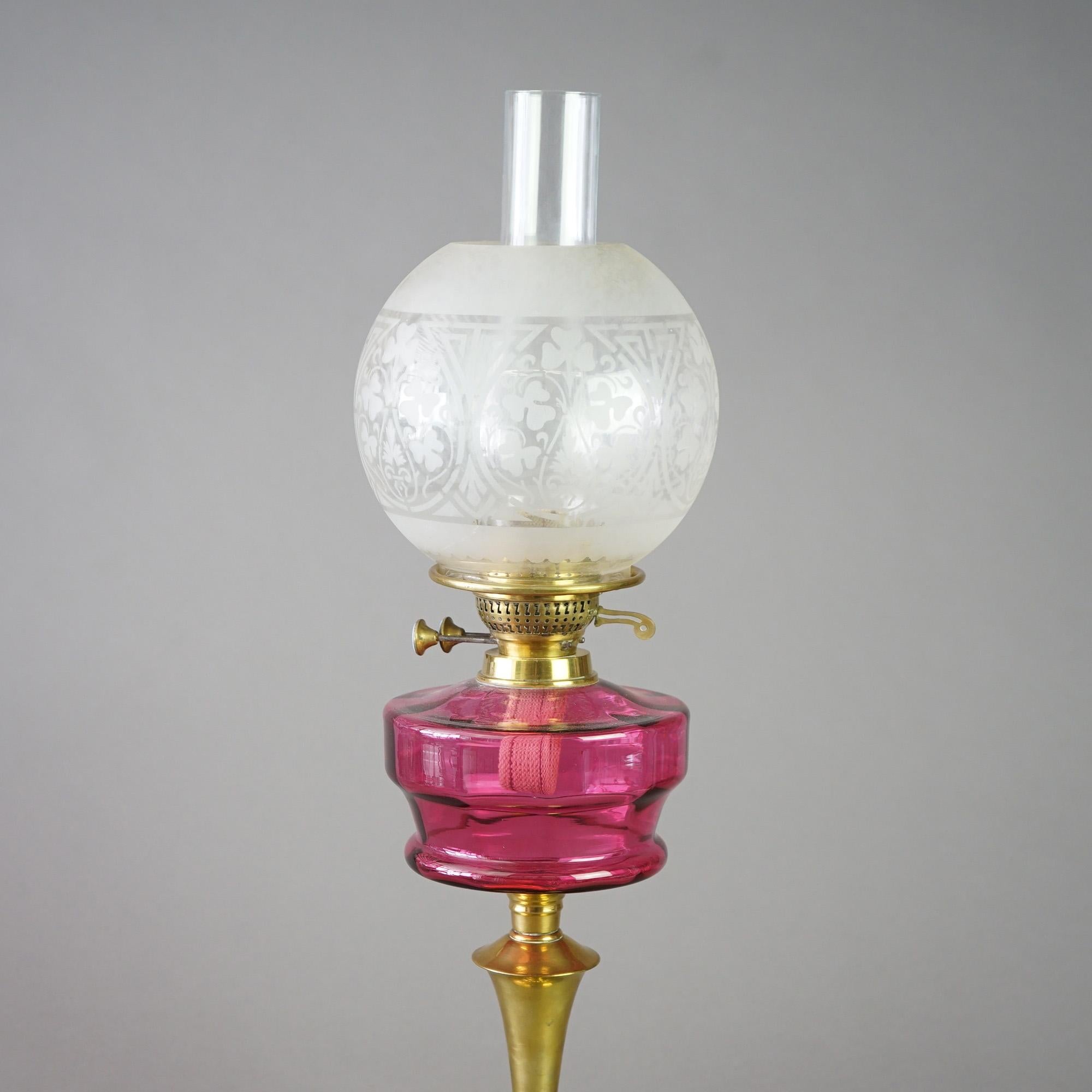 Antique Brass and Cranberry Glass “Gone With The Wind” Oil Lamp with Etched Glass Shade, Young's, C1890

Measures- 25.5''H x 7''W x 7''D