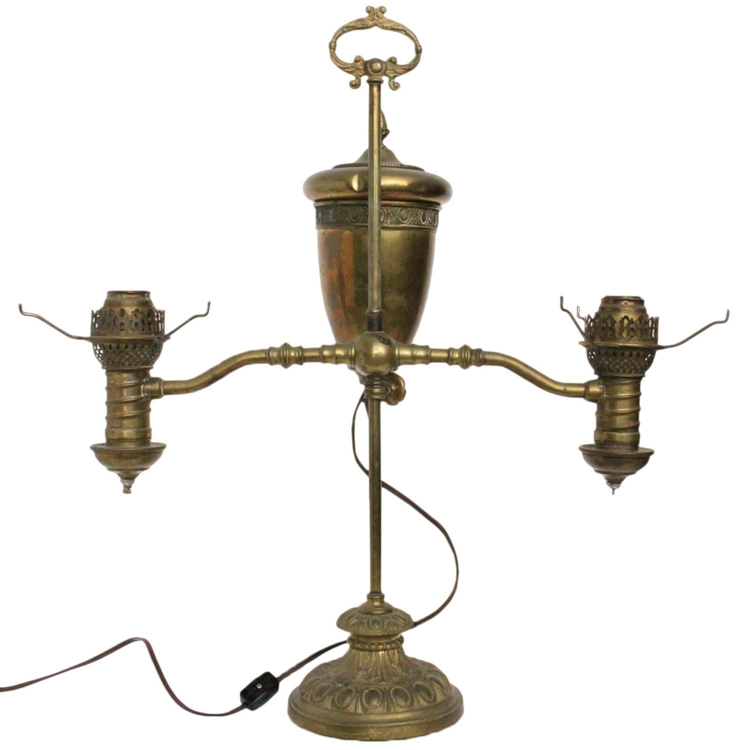 Imagine your space in the captivating glow with this brass double arm lamp with a cord length of 94 inches. This exquisite piece accommodates any standard bulb, allowing you to illuminate your surroundings with personalized brilliance. Please be