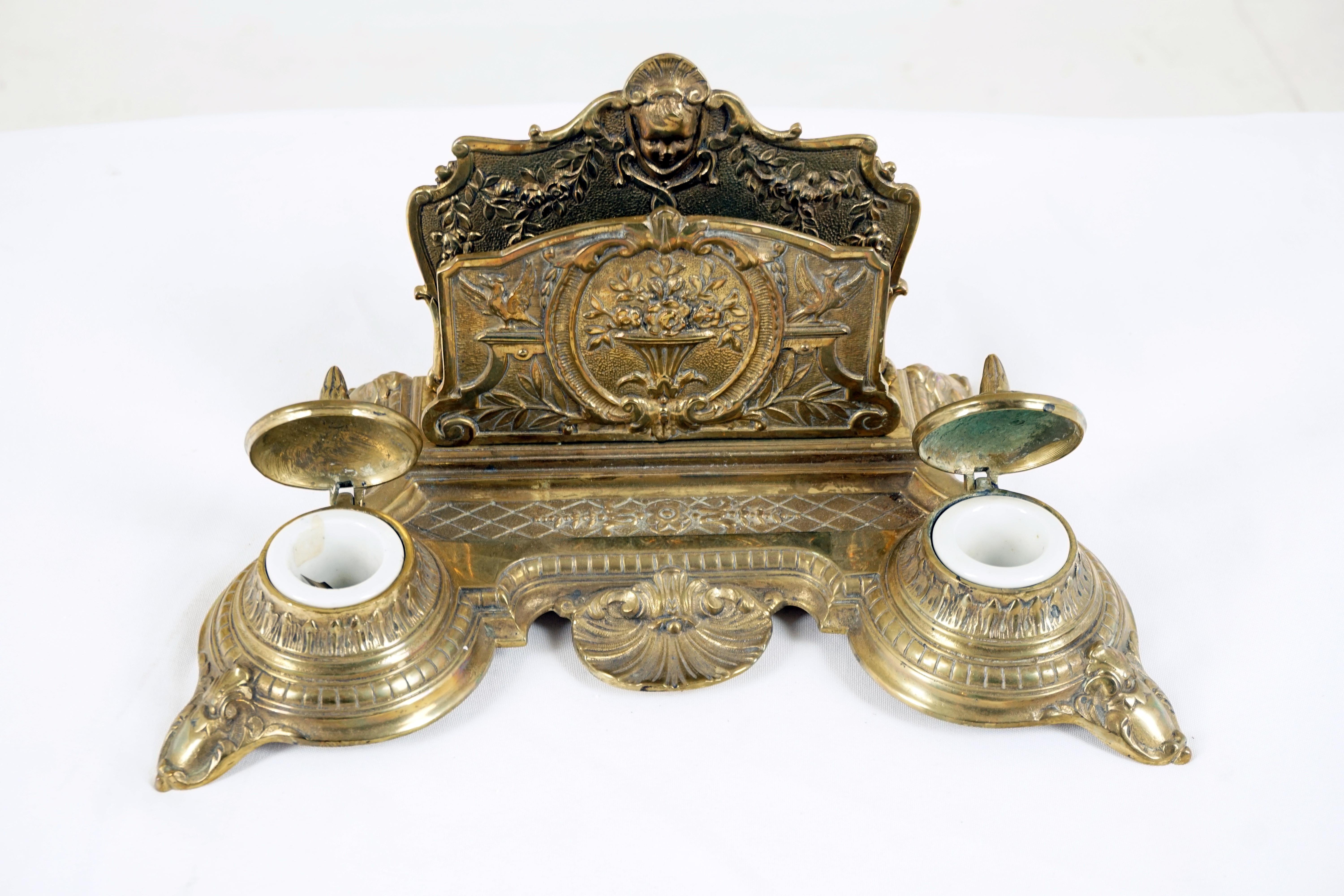 Antique Brass double inkstand, inkwell, desk set, Scotland 1910, H526

Scotland 1910
Solid brass
With letter holder to the back
Pen holder to the back
Pair of brass inkwells with lids having ceramic inserts
All standing on four carved feet
Marked