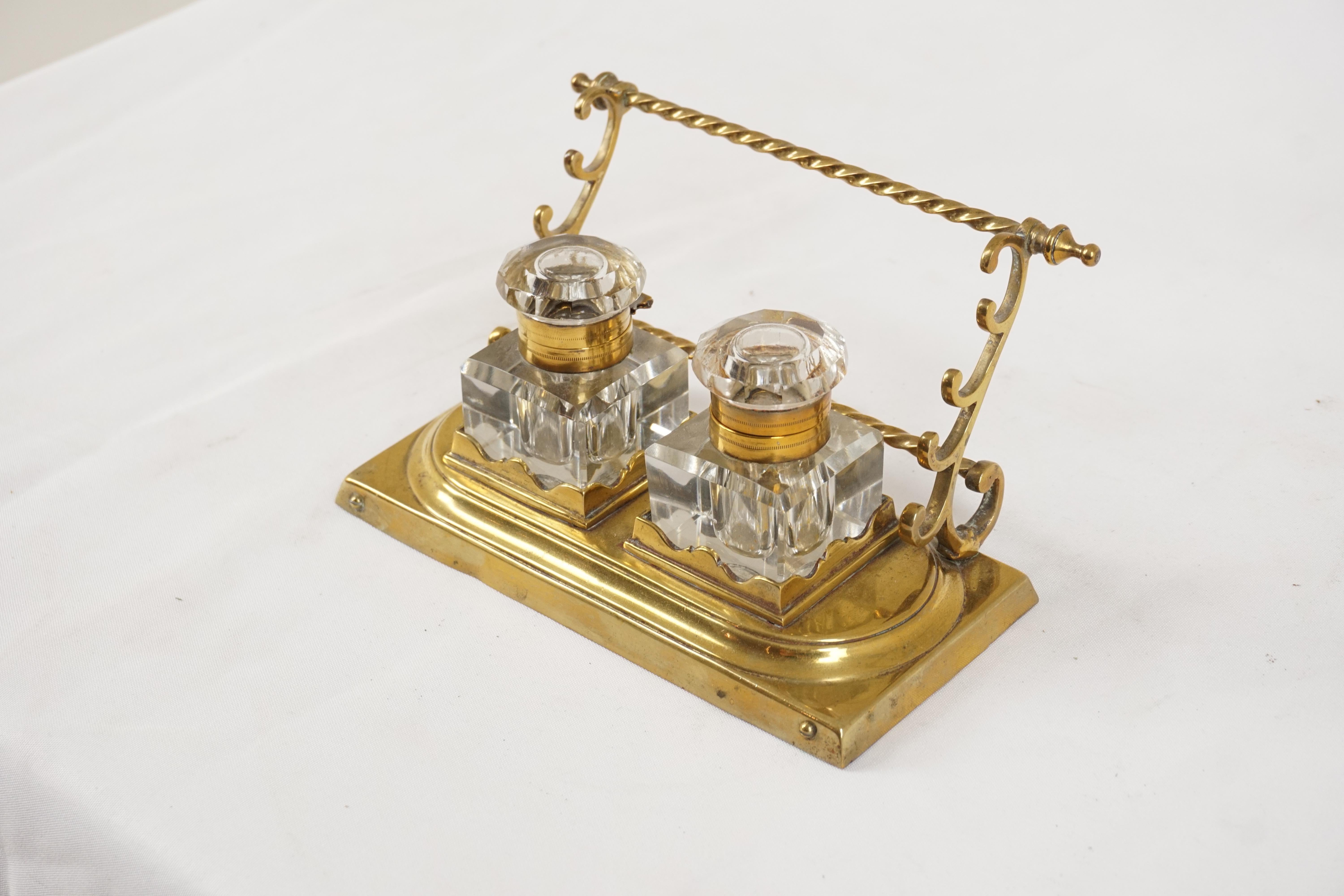 Antique brass double inkstand with pen holders, Scotland 1900, H548

Scotland 1900
Brass & glass
Brass pen holder to the back
Pair of cut glass inkwells
All standing on a shaped base

H548

Measures: 6.75” W x 4” D x 3.5” H.
   