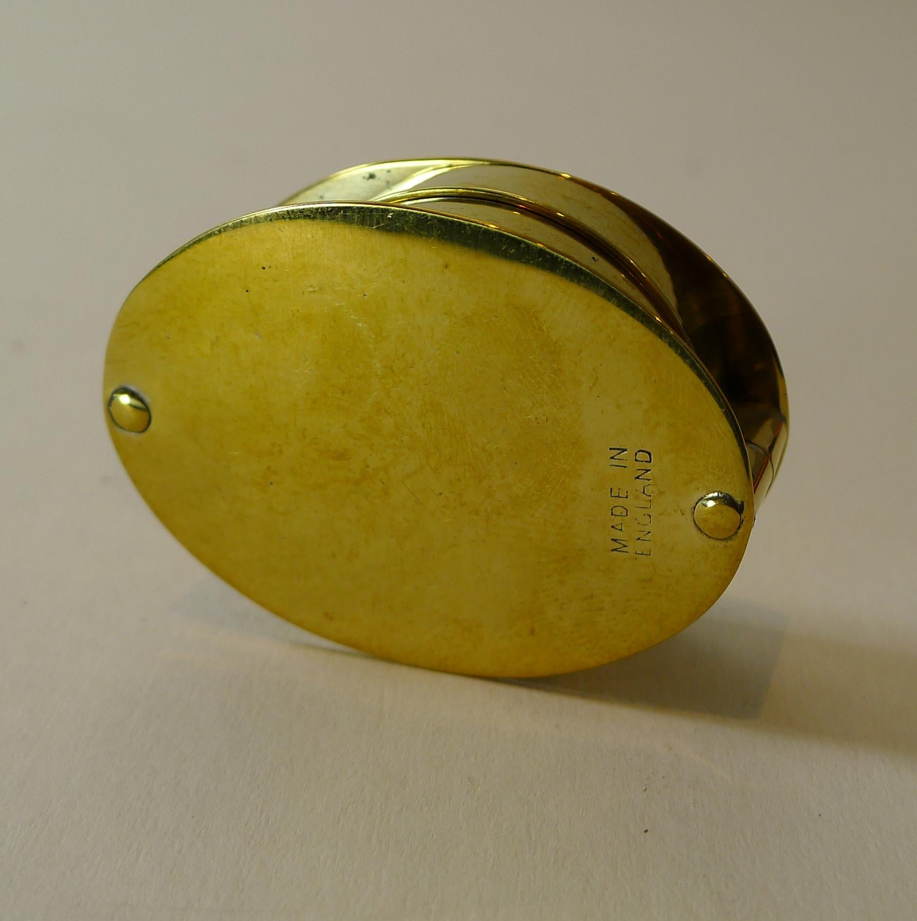 A large double lens magnifying glass made from solid English brass, stamped both sides 