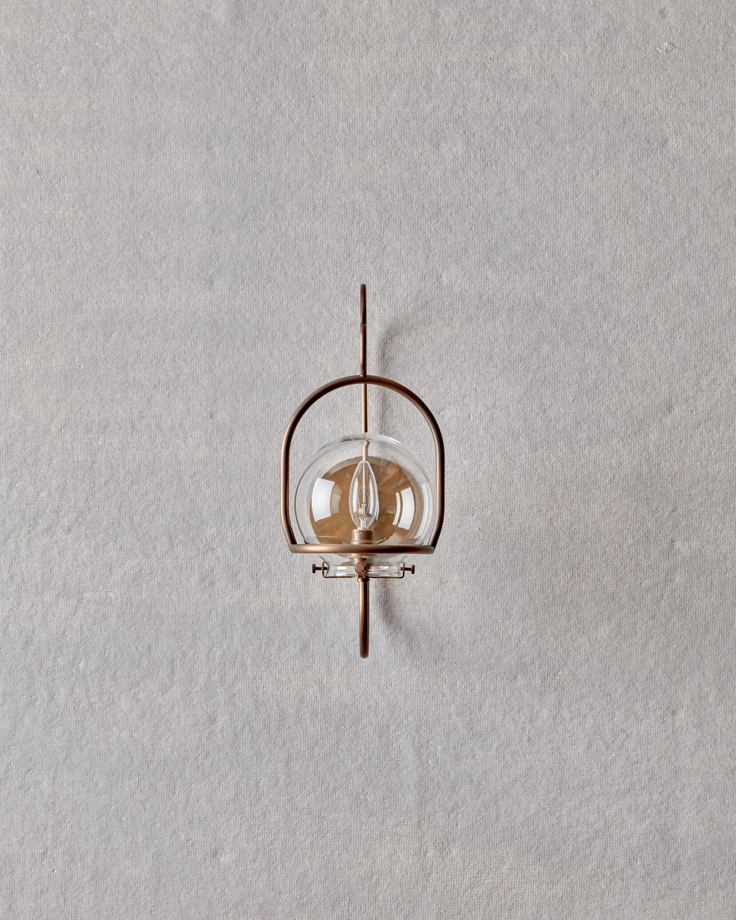 The scaled-down version of our Emil Wall Lantern provides versatility both indoors and out. Clean bent brass lines update this classic lantern with a nod to tradition.

OVERALL DIMENSIONS
7.25