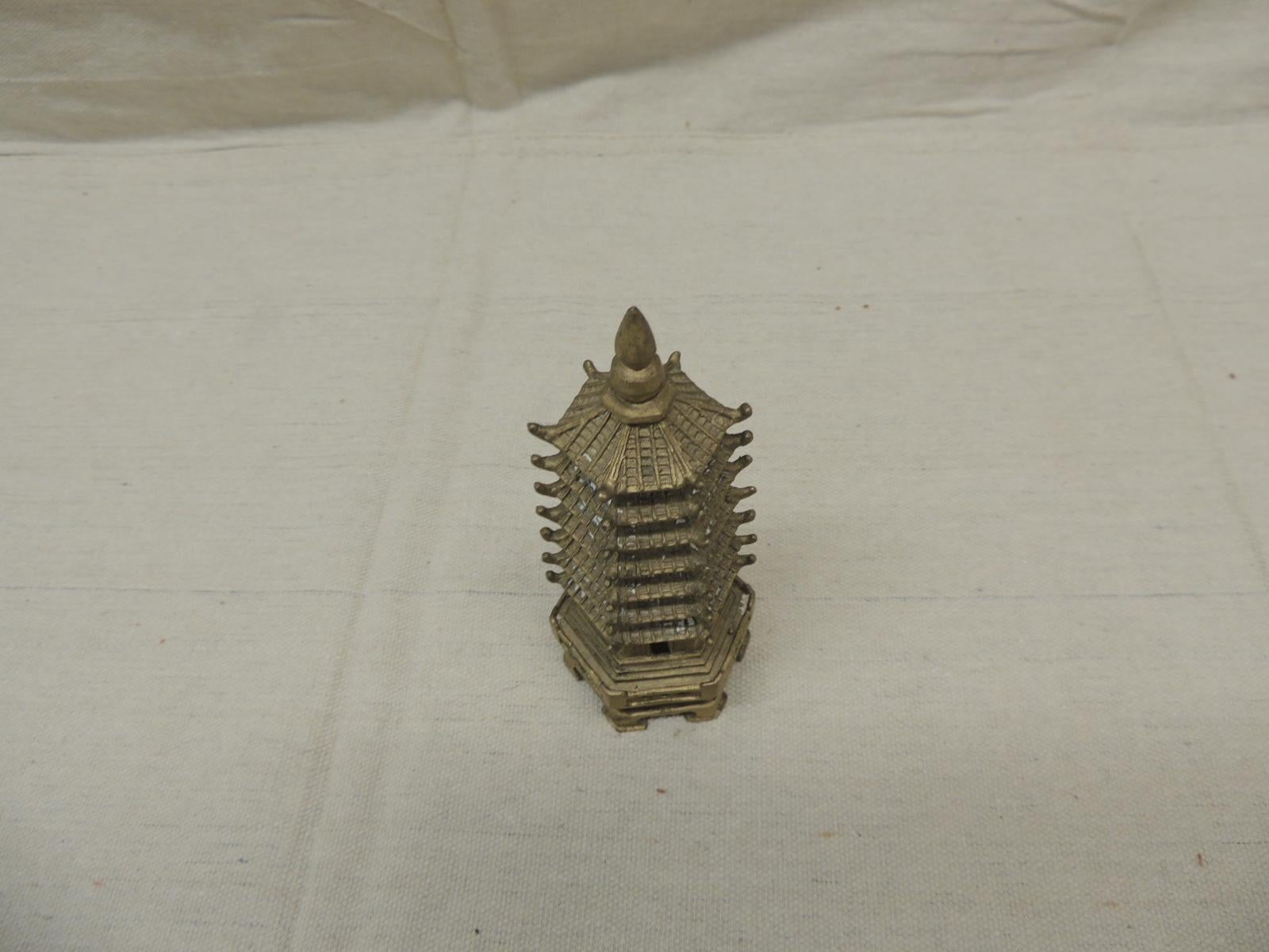 Antique brass finish miniature brass pagoda.
Size: 2