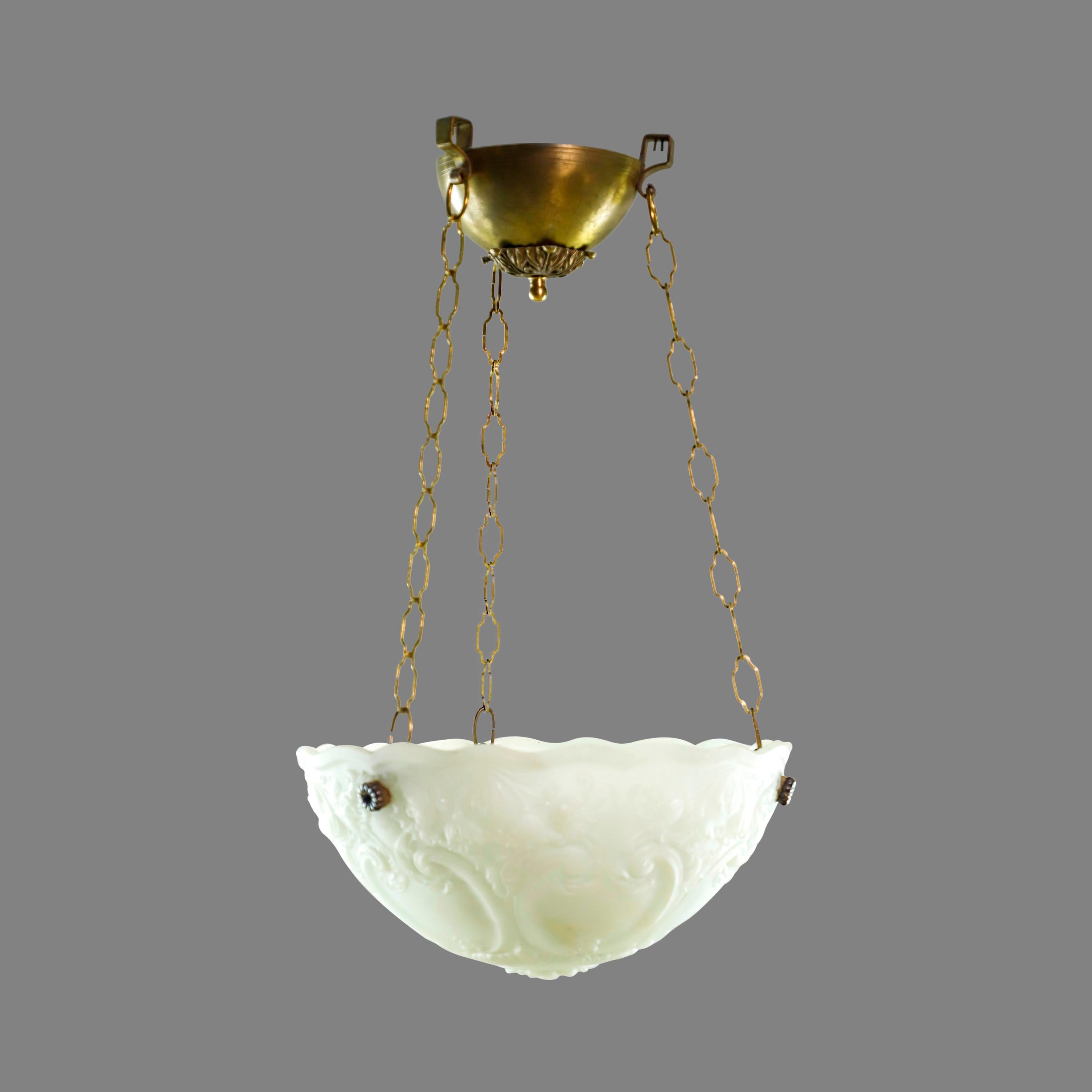 Neoclassical white glass dish pendant light with ornate cast details suspended from three chains with a brass fitter. Cleaned and restored. Takes three medium base light bulbs. Please note, this item is located in our Scranton, PA location.