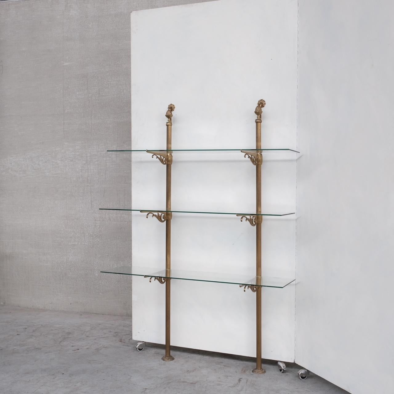 A three tiered shelf set. 

Brass and glass. 

France, c1920s. 

Ideal for bathroom, lounge or retail setting. 

Good condition, some scuffs or wear commensurate with age. 

Location: Belgium Gallery. 

Dimensions: 155 H x 31 D x 110 W