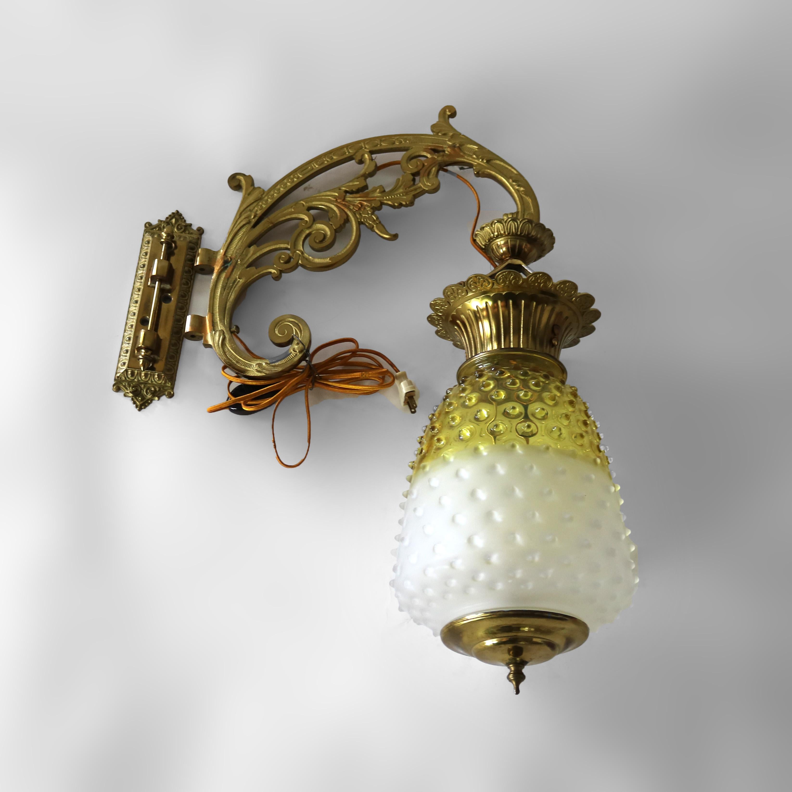 Antique Brass, Gilt Bronze & Hobnail Amberina Glass Hanging Pendant Sconce with Foliate form Frame c1890

Measures- 28