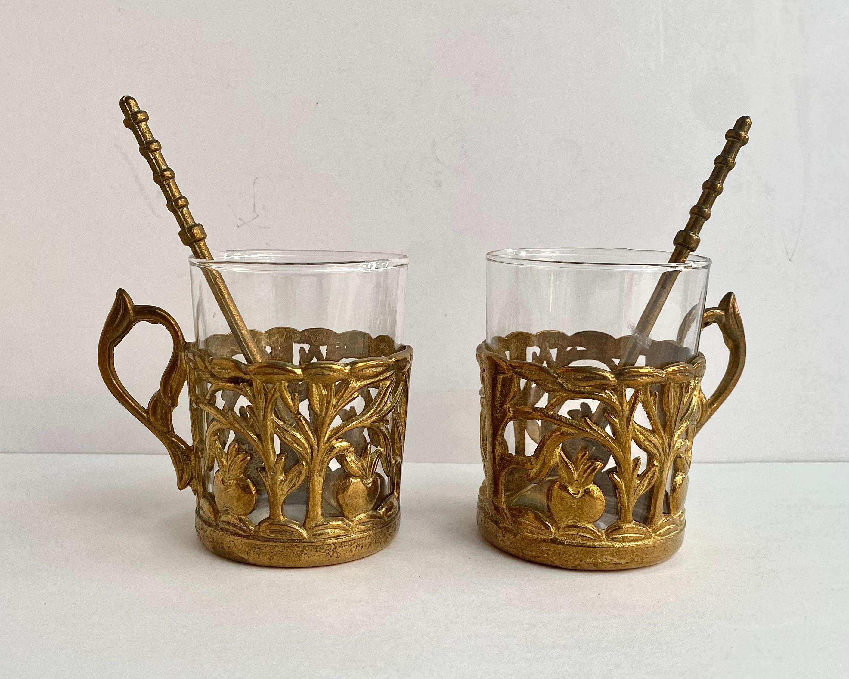 The original set of antique utensils for tea consists of 2 glass tea cups, brass glass holders and spoons.

Manufactured in France.

Please yourself or your loved ones with beautiful and elite tableware.

Handmade. Brass, glass. Engraving,