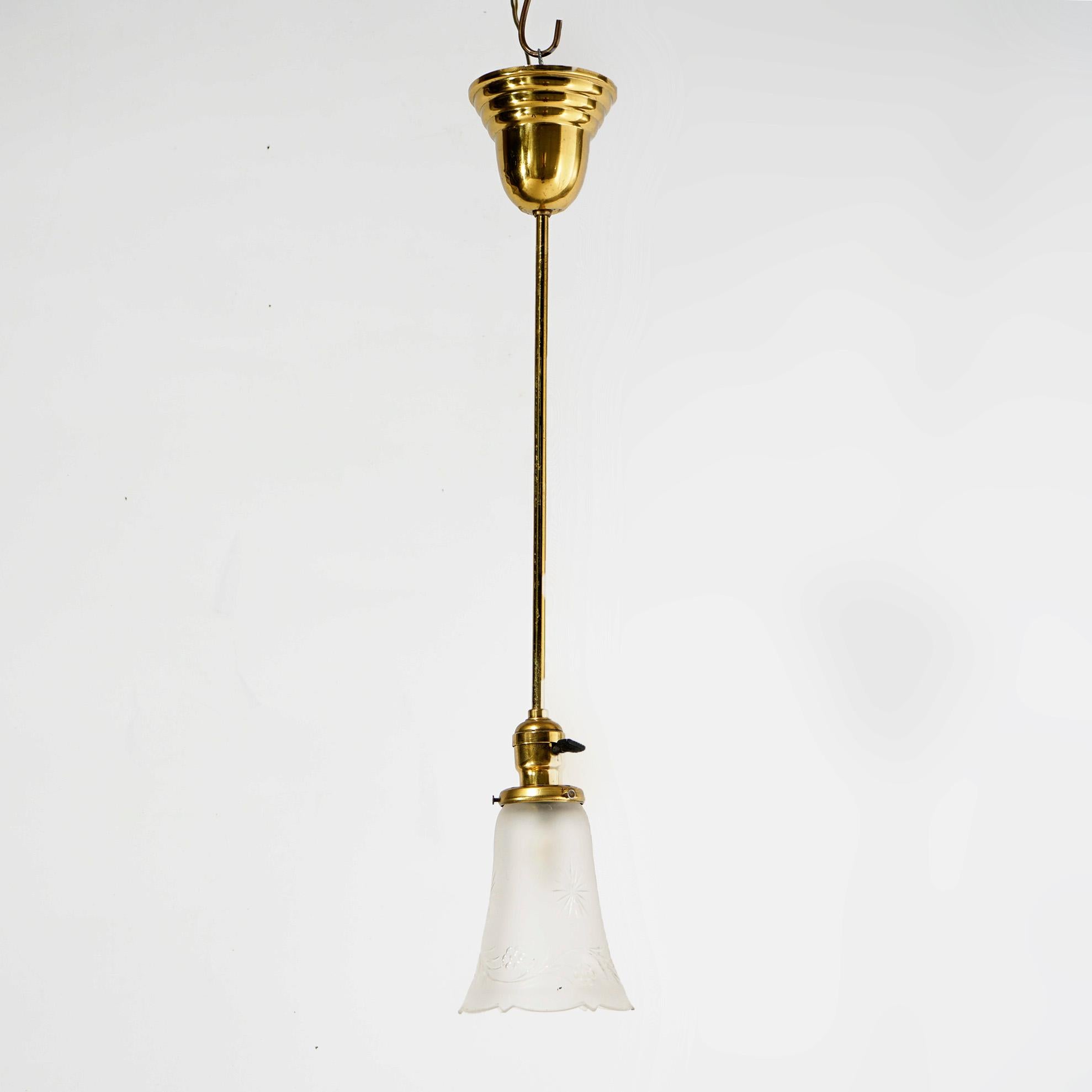 An antique hall light offers brass frame and shaft terminating in single light with frosted shade having etched floral decoration, c1920

Measures- 27.5''H x 4.75''W x 4.75''D.

Catalogue Note: Ask about DISCOUNTED DELIVERY RATES available to most