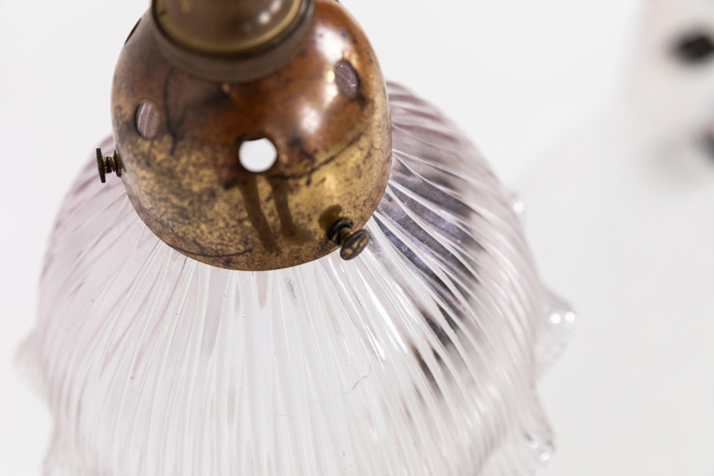 

Elegantly formed swan neck lamp with prismatic glass Holophane 'Stiletto' shade. c.1920

Former gas lamp made of brass, professionally converted to electric whilst retaining the original parts of the lamp, with complementing Holophane