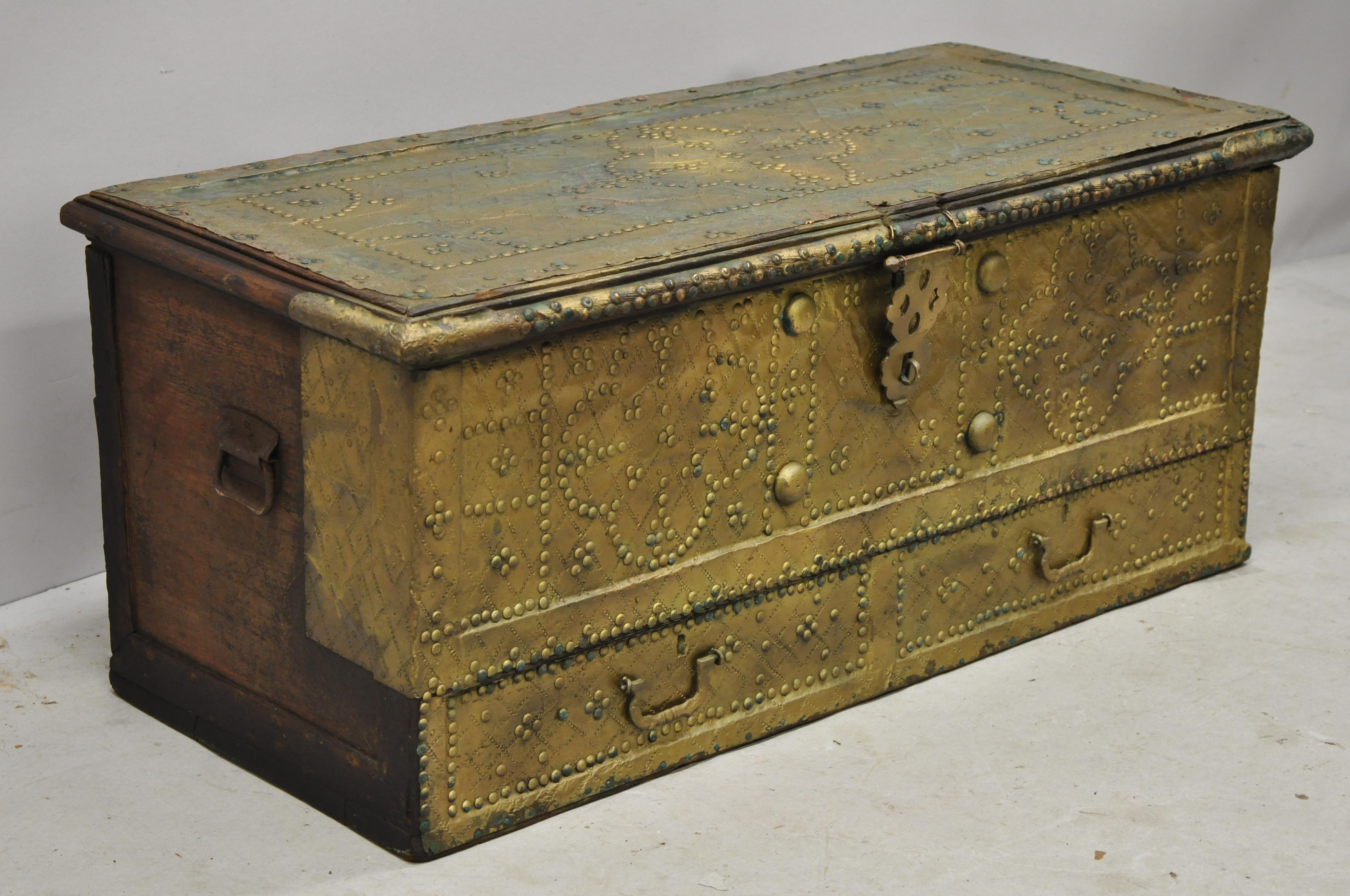 Antique brass-clad Indian Gothic Mediterranean dowry trunk storage treasure chest. Item features brass-clad case with nailhead trim, cast iron hardware, faux drawers, heavy solid wood construction, distressed finish, very nice antique item, circa