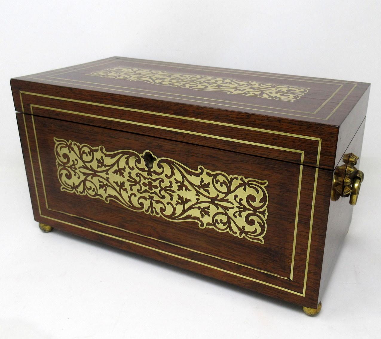 Superb Example of an English Regency well grained Mahogany Double Tea Caddy of traditional rectangular outline, with lavish brass scrolling inlay decoration and complete fitted interior to include two firm fitting hinged lid lift-out sliding