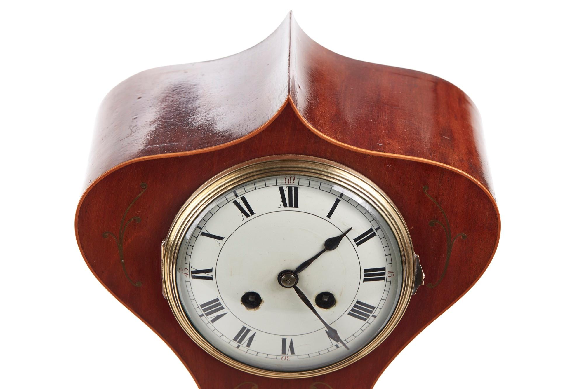 Antique brass inlaid mahogany Art Nouveau balloon shaped mantle clock, striking on a gong. 8 day movement. Original key and perfect working order.