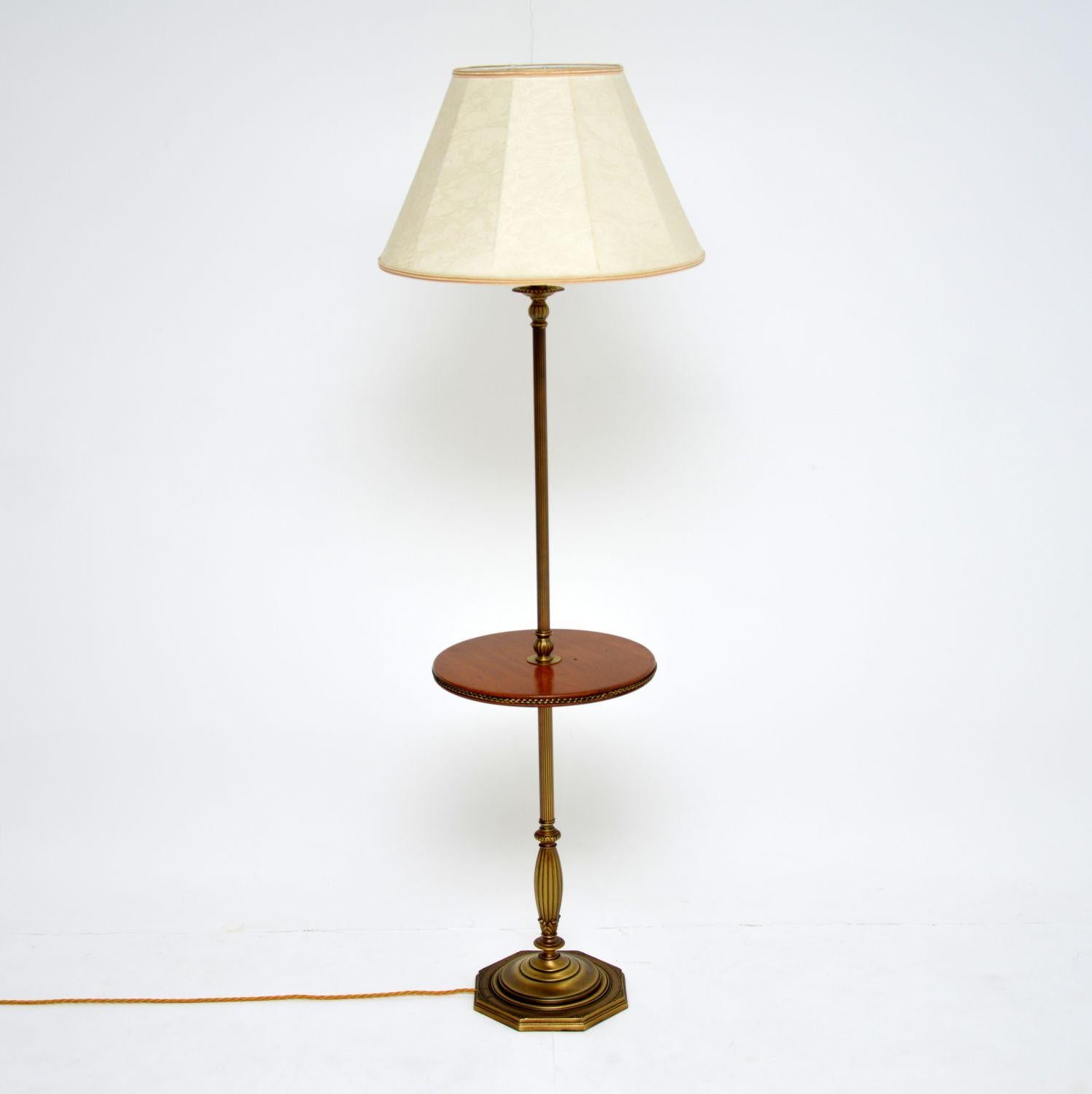 A beautiful antique floor lamp dating from the 1920s-1930s, this is of super quality. The solid brass frame is extremely well made with beautiful detailing throughout. The base is particularly beautiful, as is the rope edge design around the built