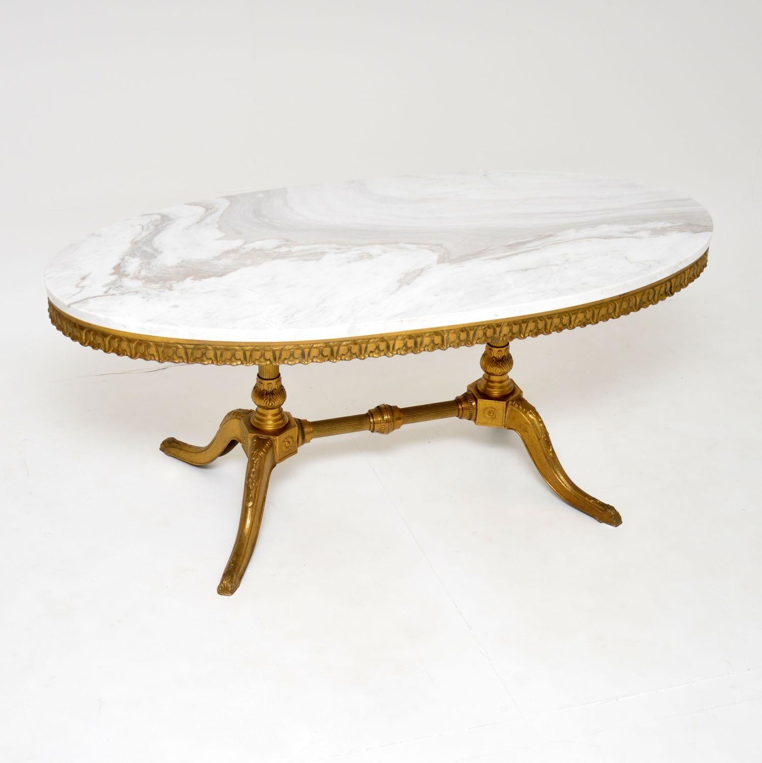 A beautiful antique coffee table in solid brass with a white marble top, dating from around the 1920-30’s.

The quality is excellent, the brass frame is beautifully detailed and is a very useful size. The white marble top has been newly made for
