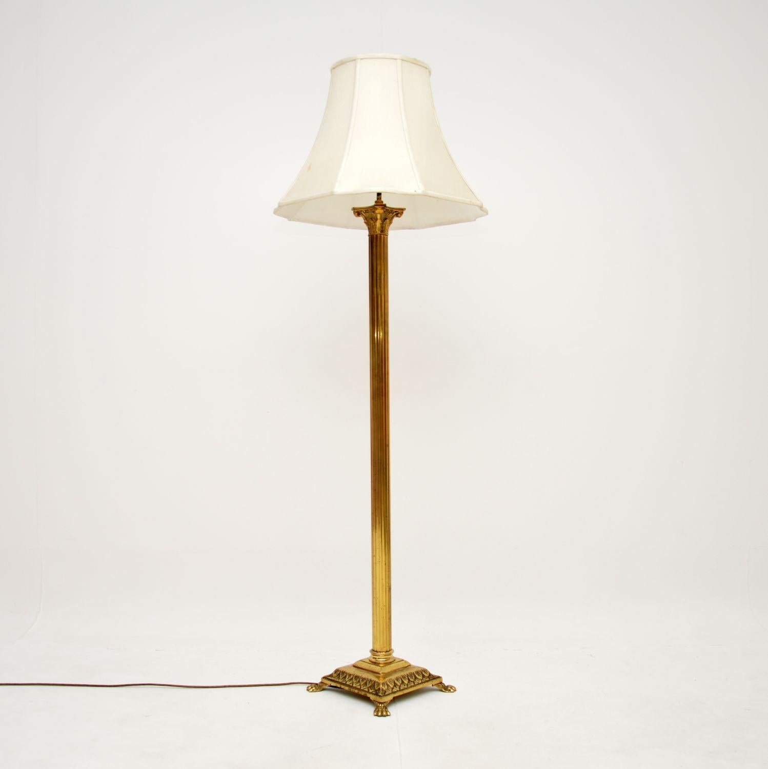 A stylish and extremely well made antique brass neoclassical floor lamp. This was made in England, it dates from around the 1920-30’s.

The quality is superb, this has a bold fluted Corinthian style column that sits on a platform base, with hairy