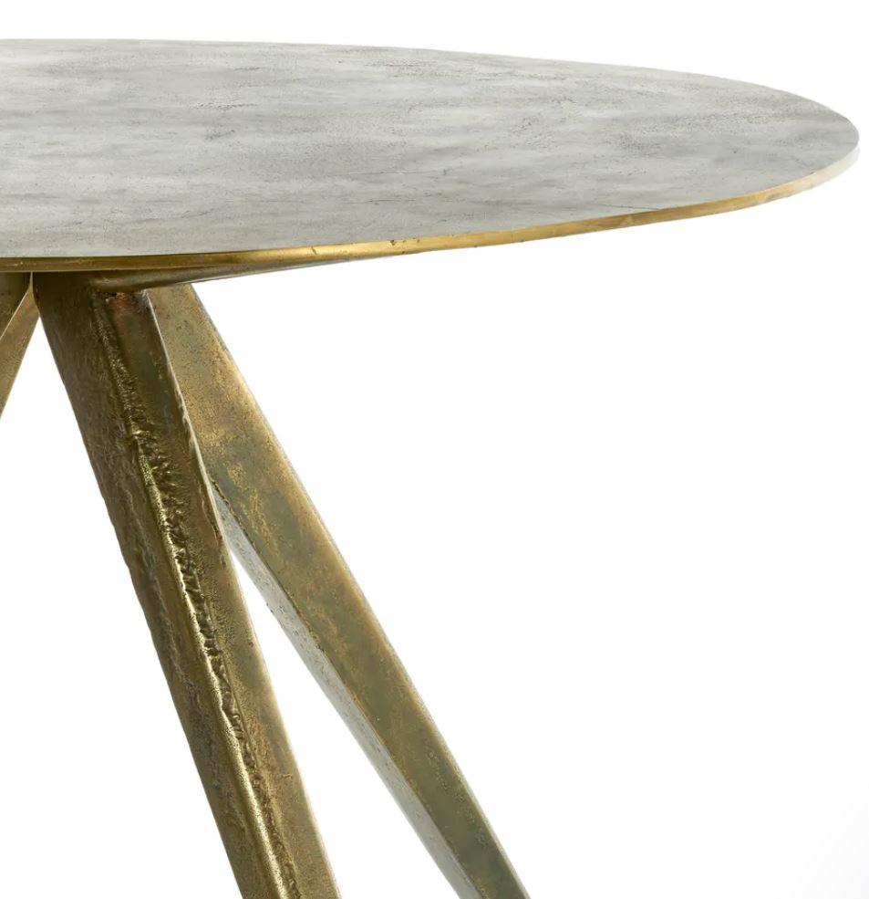 Antique brass plated circle table- Pols Potten Studio.
Dimensions: 100 diameter x height 75 cm.
Materials: Antique brass plated aluminium.


Pols Potten products are characterised by a modern twist on Traditional Design. Each of their original