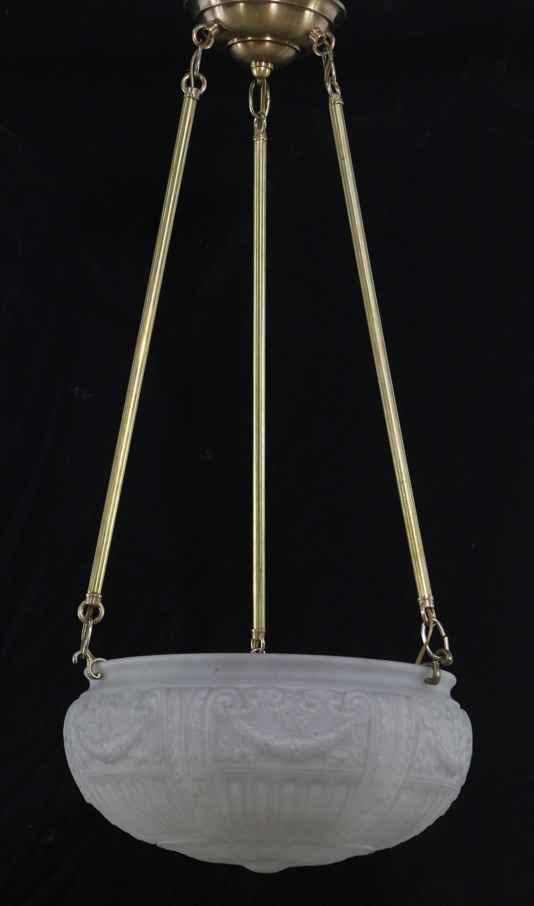 White cast glass dish pendant light with ornate swag and foliate details suspended from three brass poles with a brass canopy. Cleaned and restored. Takes three medium base lightbulbs. Please note, this item is located in our Scranton, PA location.