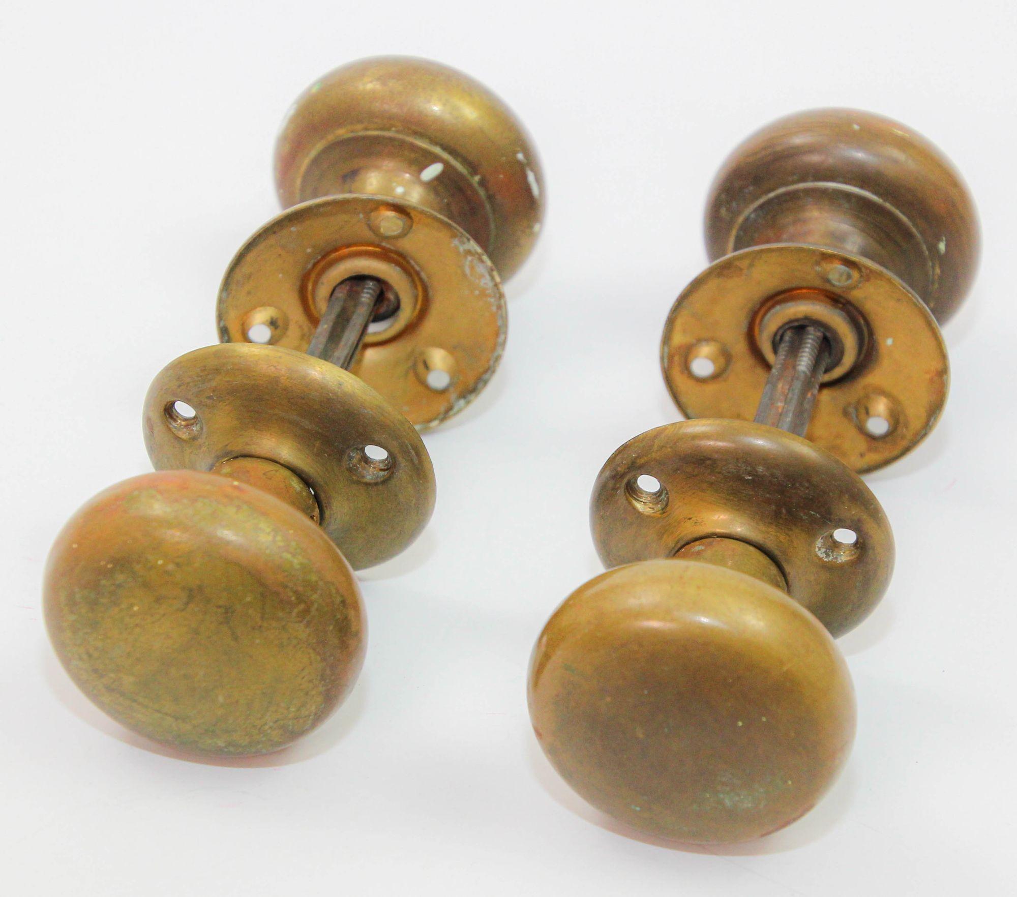 Antique patinated round brass passage door knobs sets on square spindle with rosettes.
These antique traditional door knobs will add timeless character to any door, rustic, farm house, horse property or french provincial or mountain cabin, Victorian