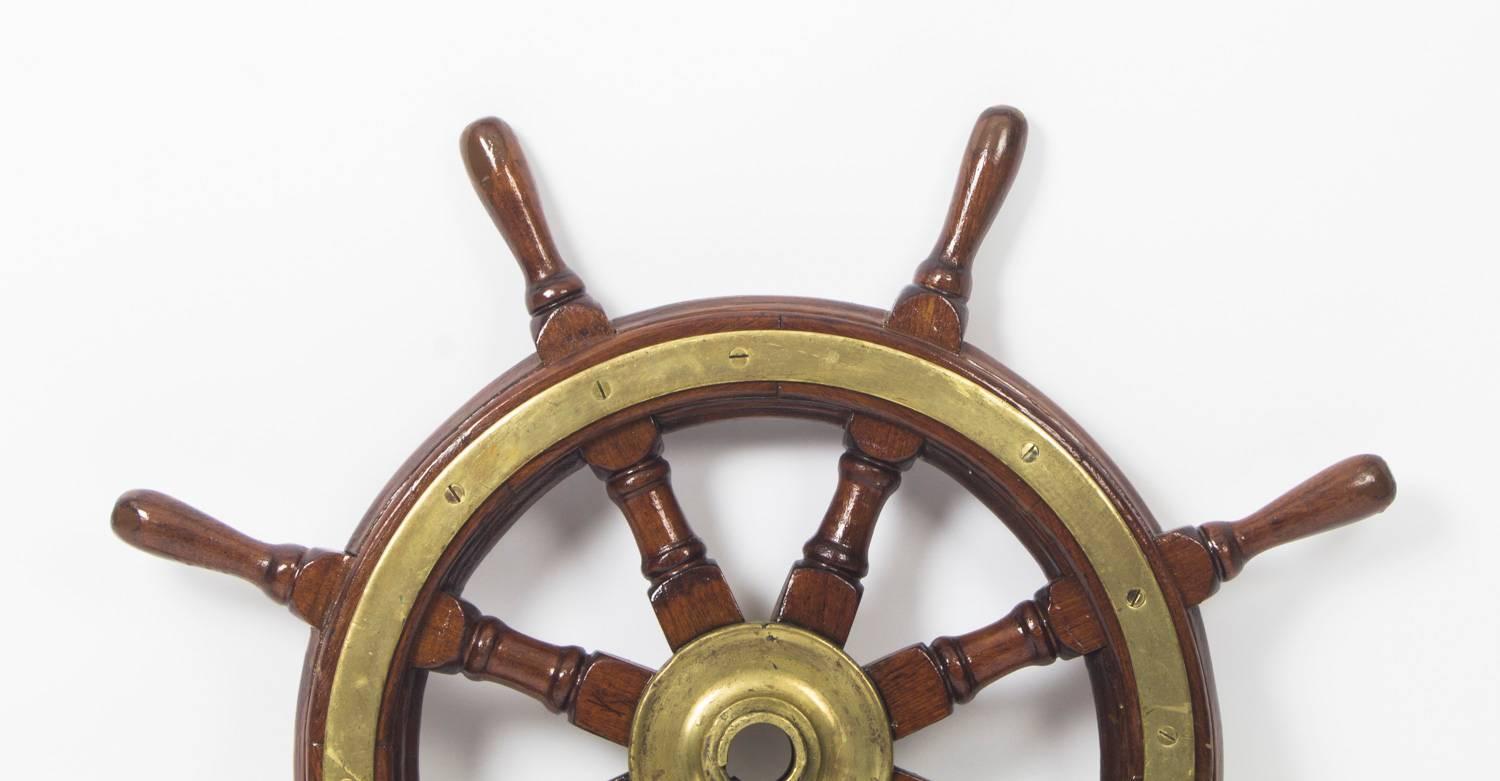 A superb antique 19th century mahogany and brass set ships wheel, eight turn spokes, with brass centre cap, in original untouched condition.

Measurements:
80 cm in diameter.
 
Condition:
In excellent condition, please see photos for