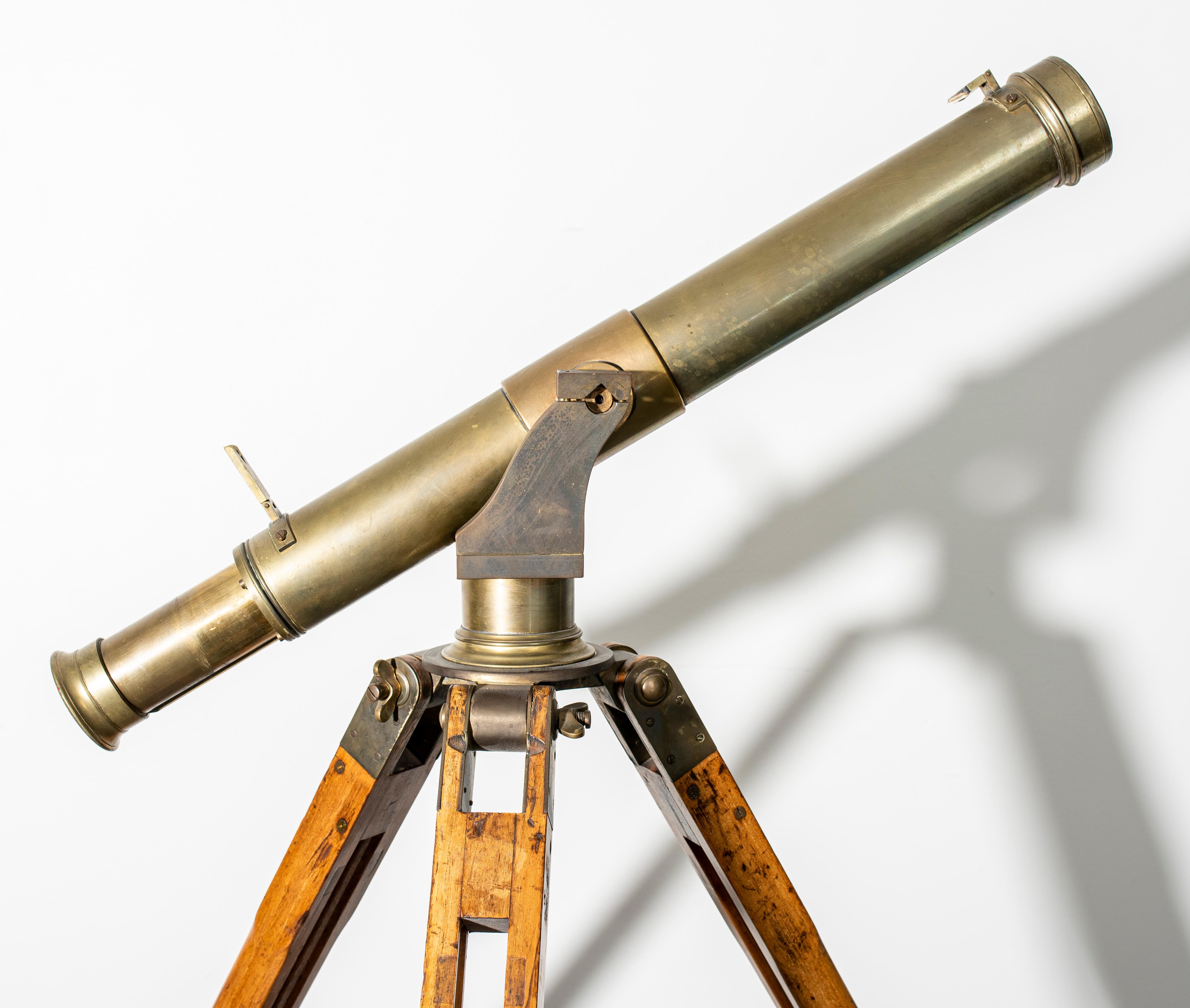Antique brass telescope on adjustable tripod stand base, possibly English, unsigned. Measures: 47” H x 43.5” diameter.