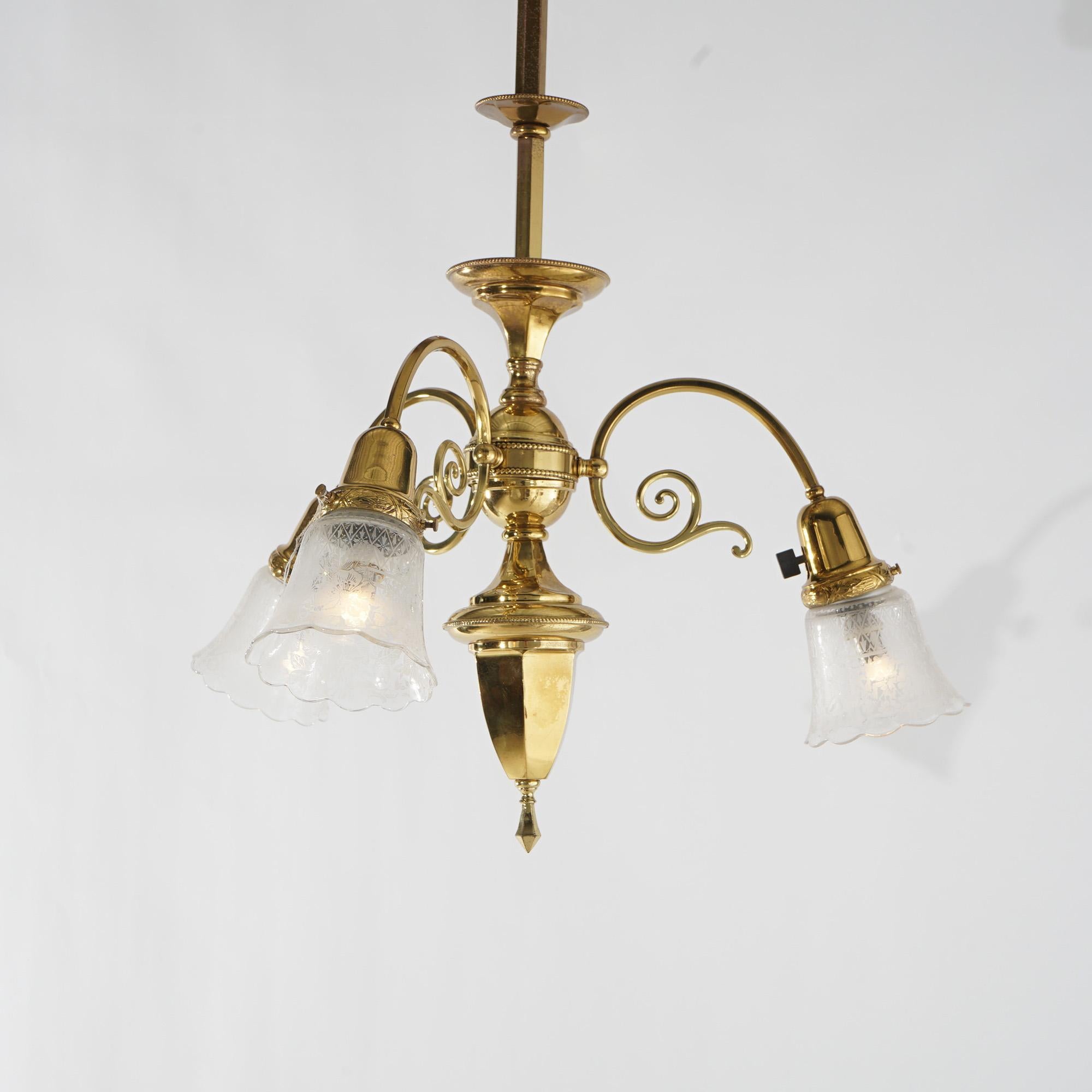 Antique Scrolled Brass Three Light Hanging Fixture with Faceted Font, Circa 1920

Measures- 30.5''H x 21''W x 21''D