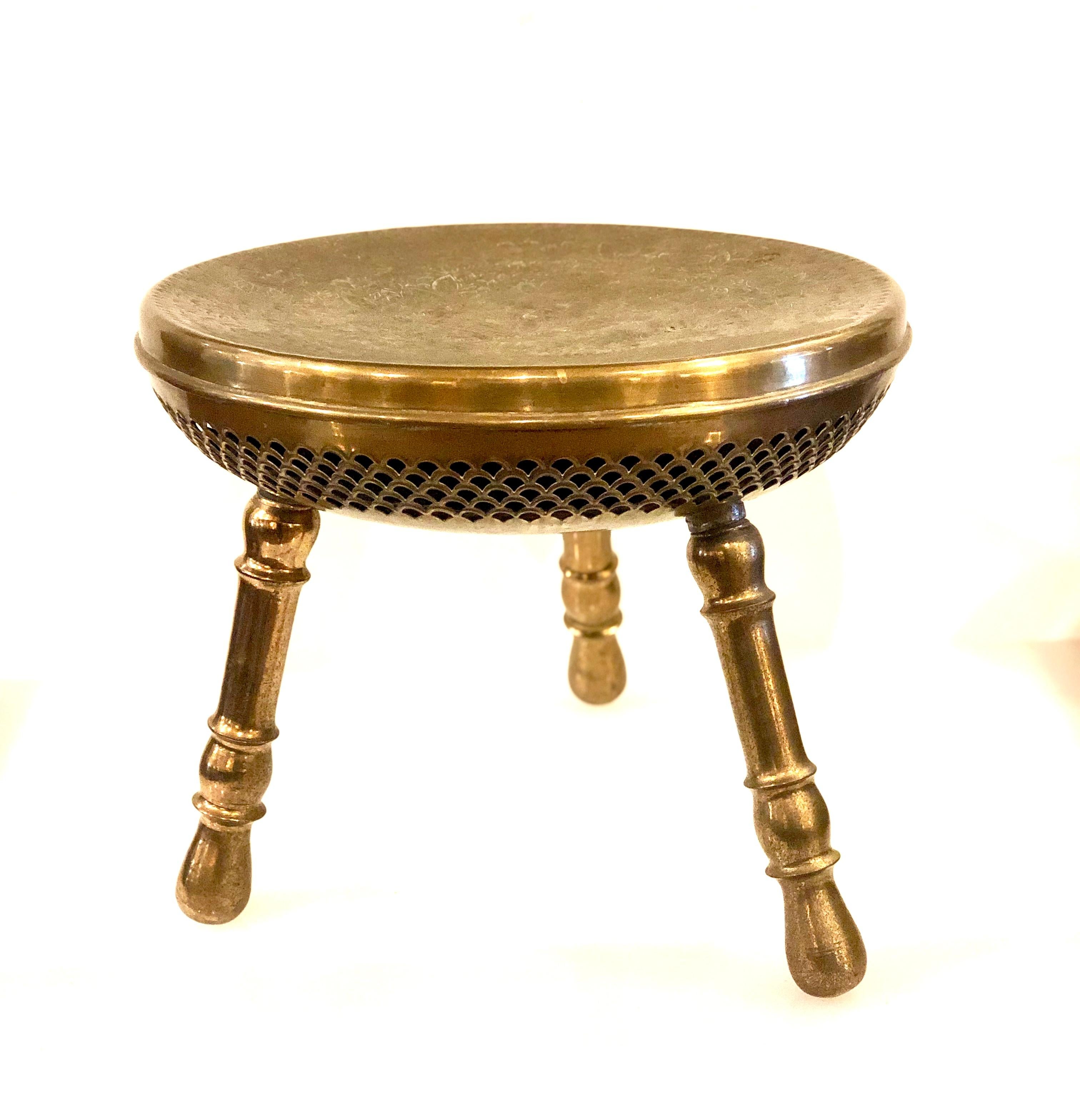 Antique brass tri legged foot warmer Indian low stool, with nice patina finish one leg unscrew for the fuel to ignite and use like a foot warmer, interesting decorative and functional.