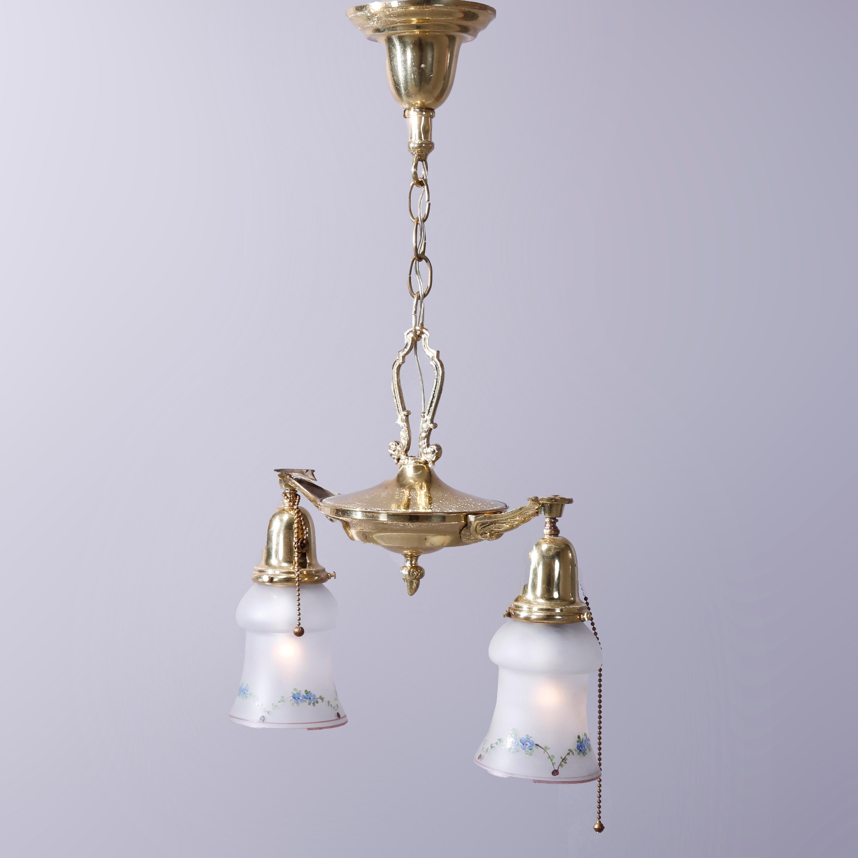An antique ceiling fixture offers brass frame with two drop-lights terminating in hand painted glass shades, c1920

Measures - 24'' H x 13.5'' W x 6'' D; 29'' overall, 6'' chain.

Catalogue Note: Ask about DISCOUNTED DELIVERY RATES available to most
