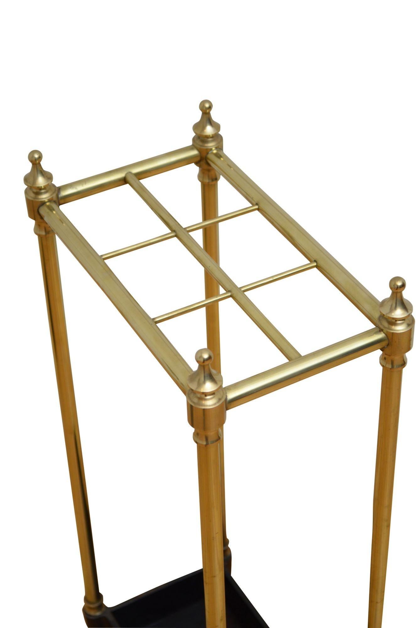 P0268 Elegant brass umbrella stand with six compartments, four decorative finials and cast iron drip tray. This antique umbrella stand has been gently cleaned and polished, all in home ready condition. UK delivery included. c1890
H25.5